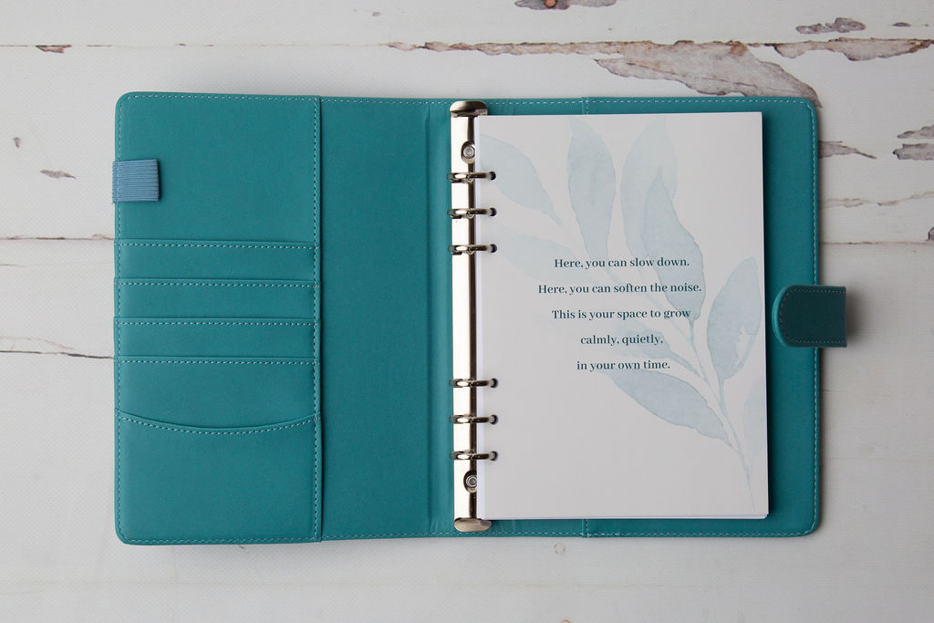 The Unfrazzled Planner open to a botanical reflection page