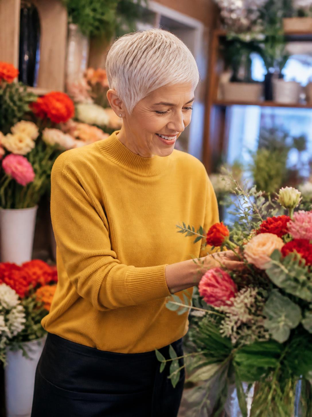 A florist making a Christmas wreath