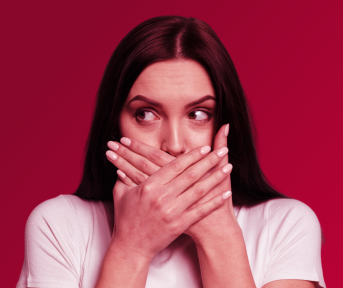 Woman covering her mouth