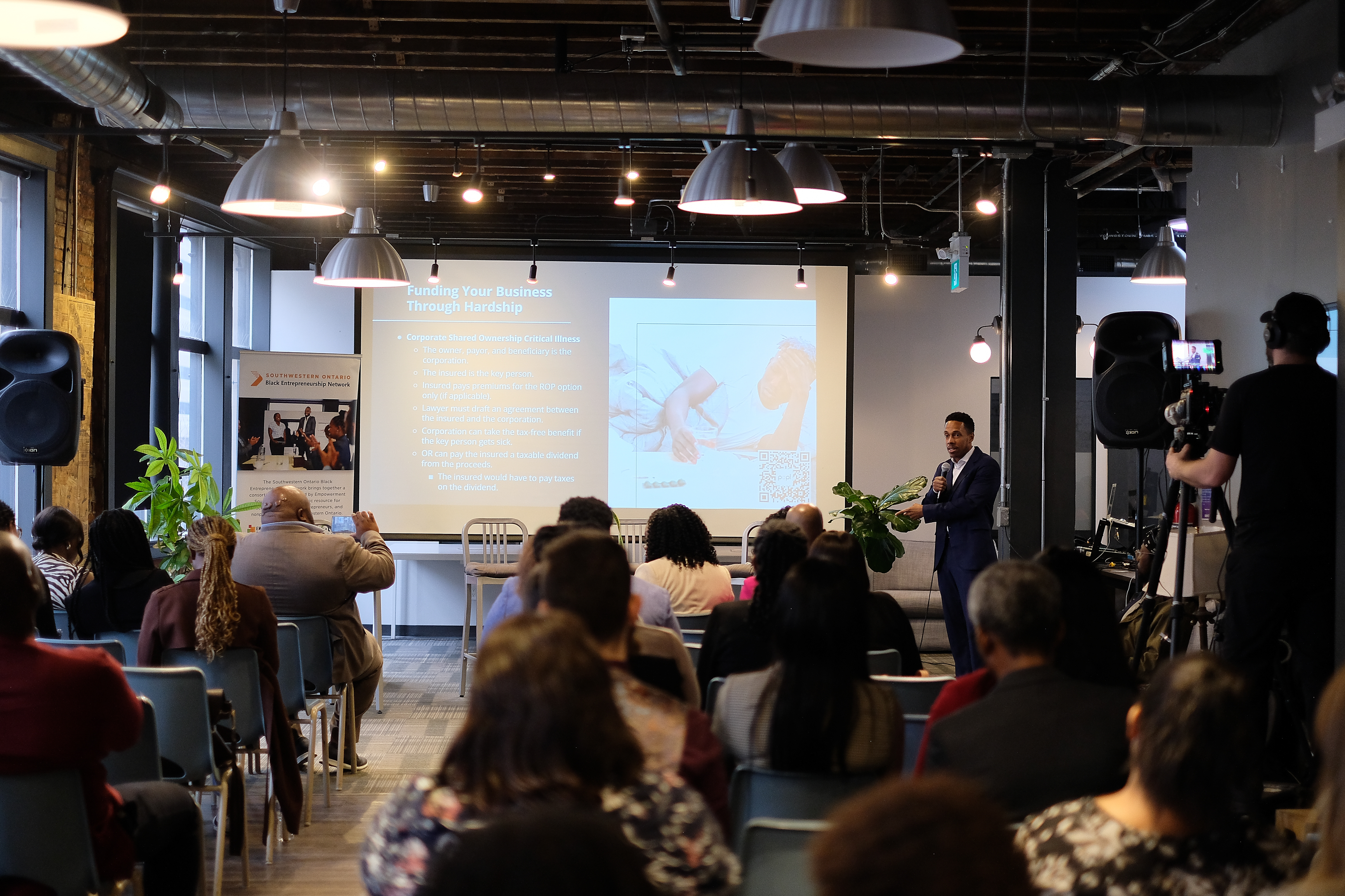 Kadeem McLean speaking at a live event