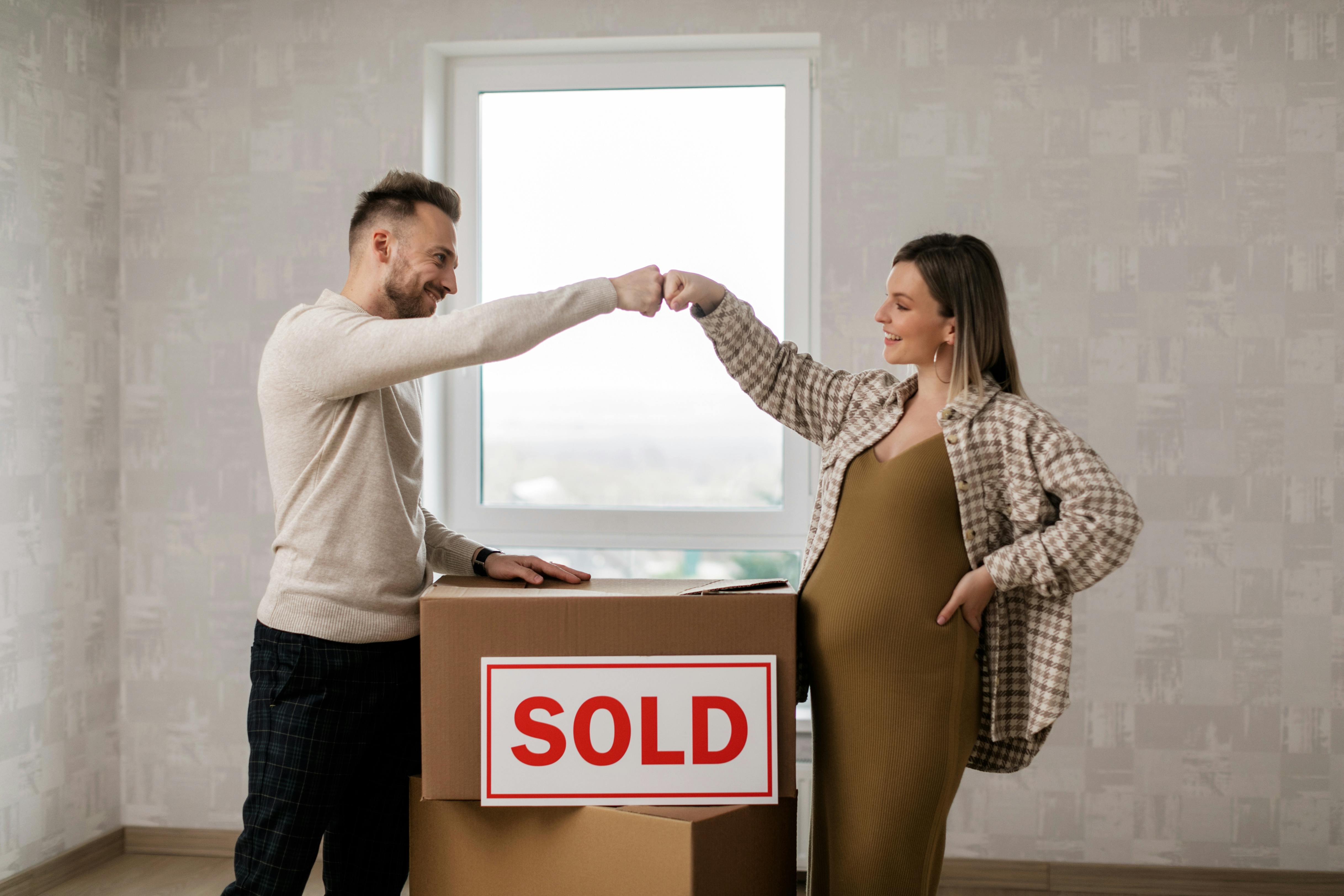 Adult child helping elderly parent review home finances. Adult child helping elderly parent review home finances.