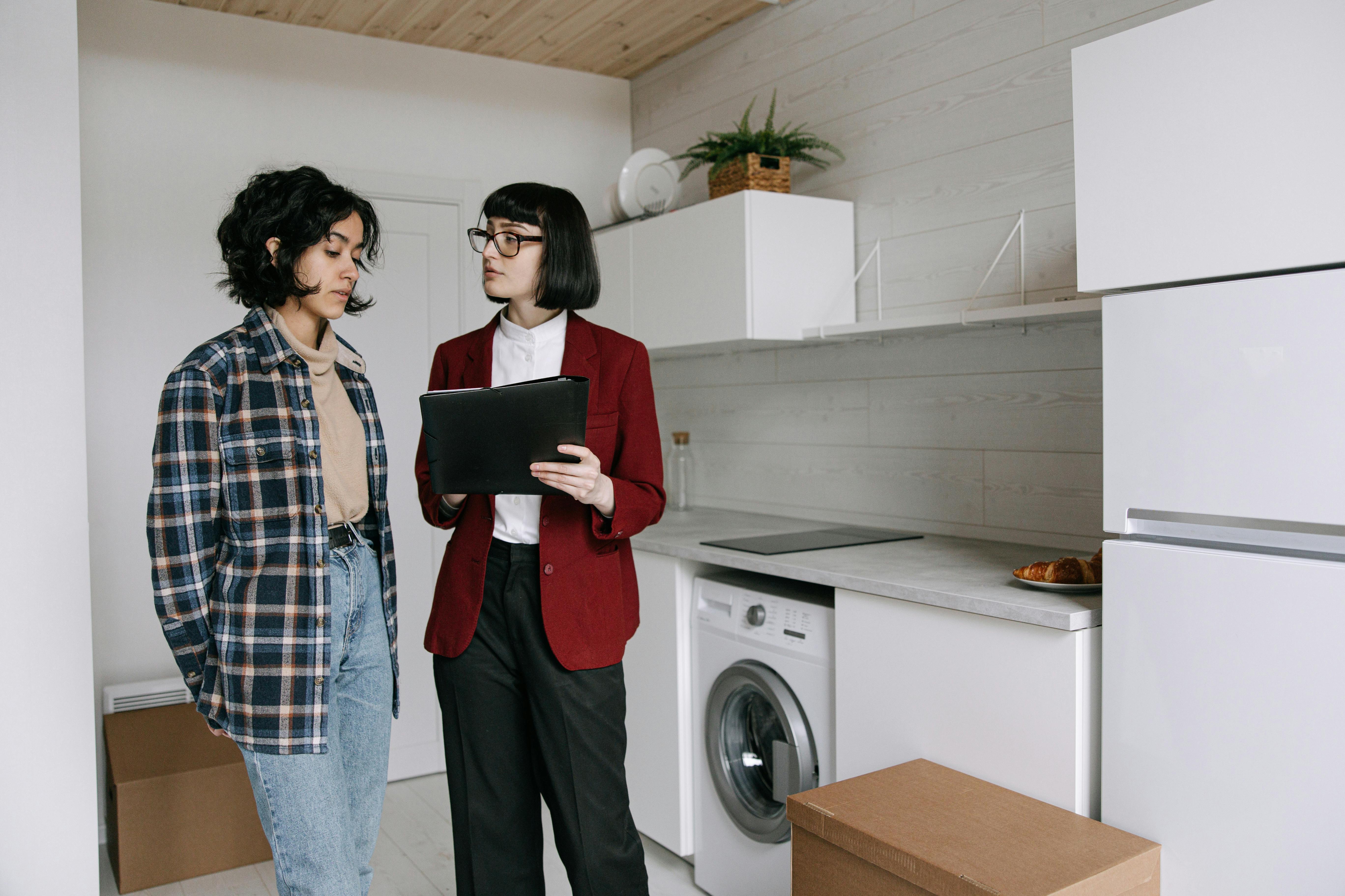 Homeowner reviewing costly pre-sale repair decisions before selling a house.