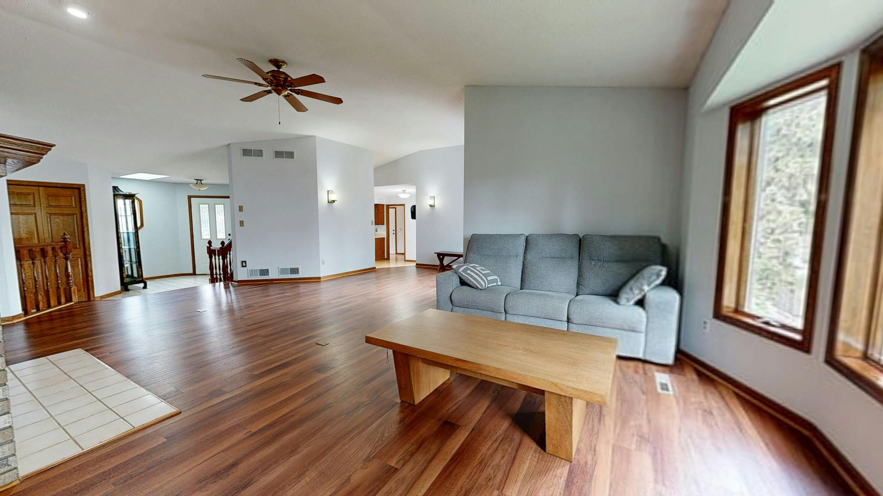 Decluttered living room with clear walking paths for home staging.