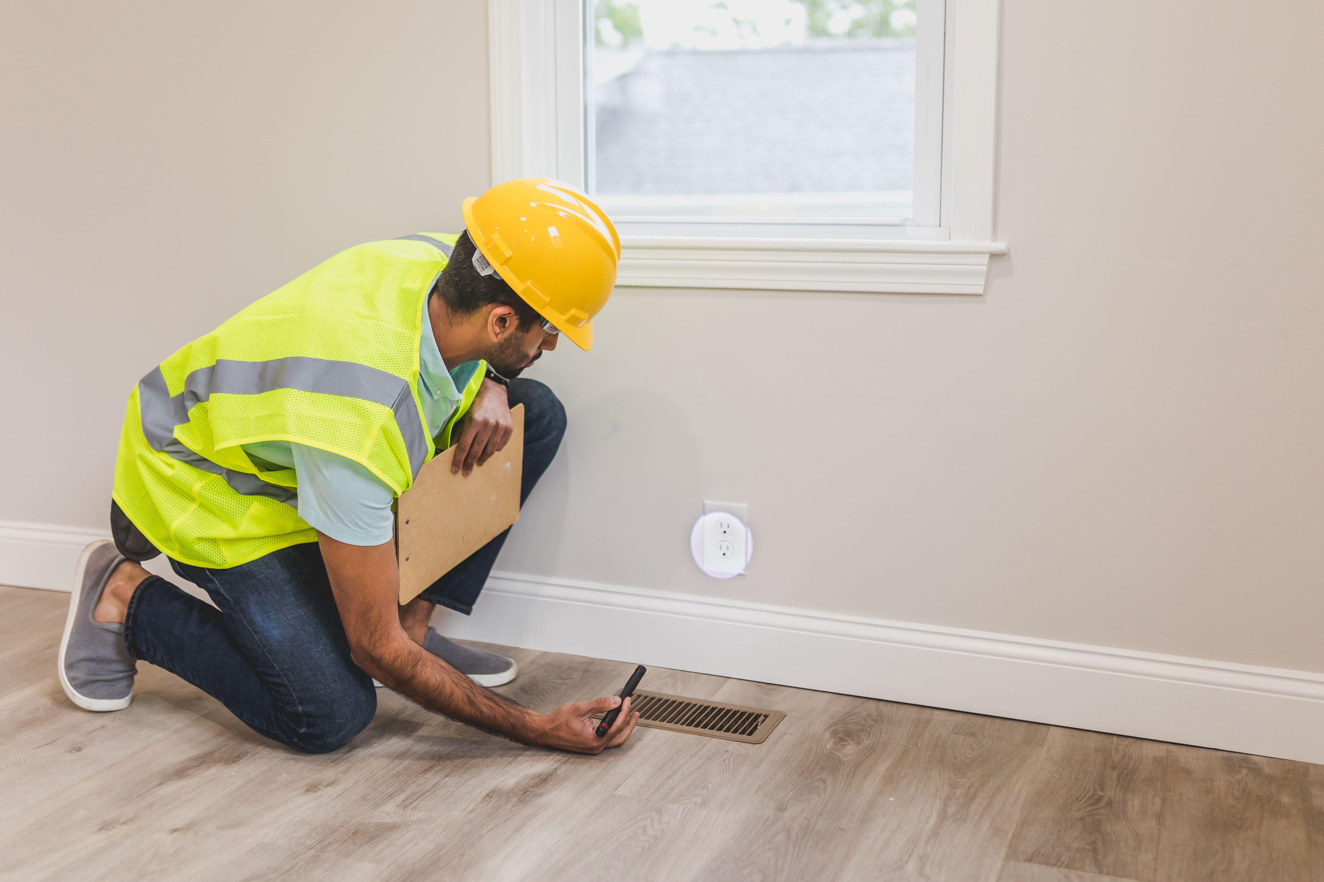 Home inspector conducting a pre-listing inspection before a property goes on the market. Home inspector conducting a pre-listing inspection before a property goes on the market.