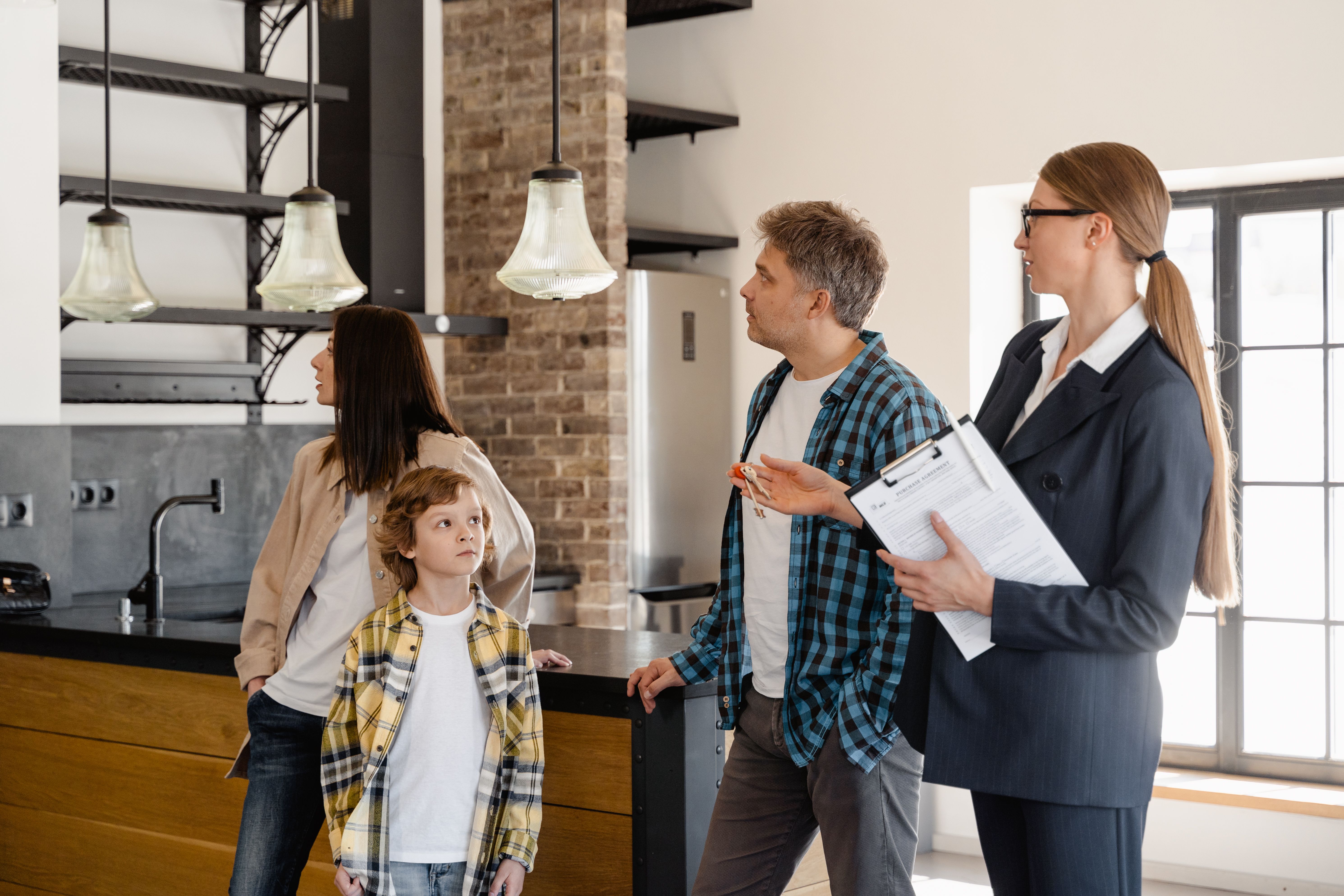 Home seller reviewing inspection report and repair documentation before listing a property. Home seller reviewing inspection report and repair documentation before listing a property.