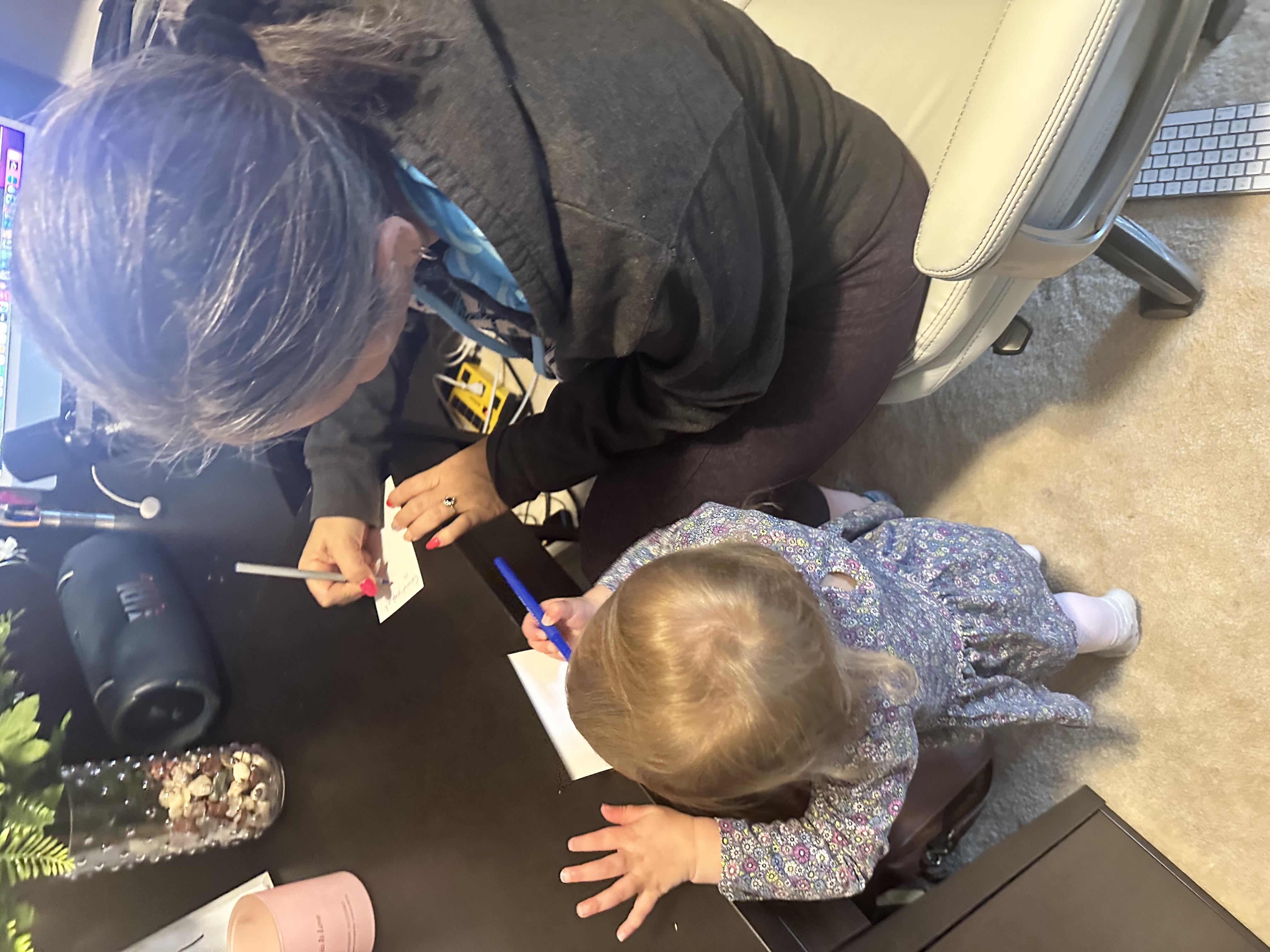 Harlie writing at the desk