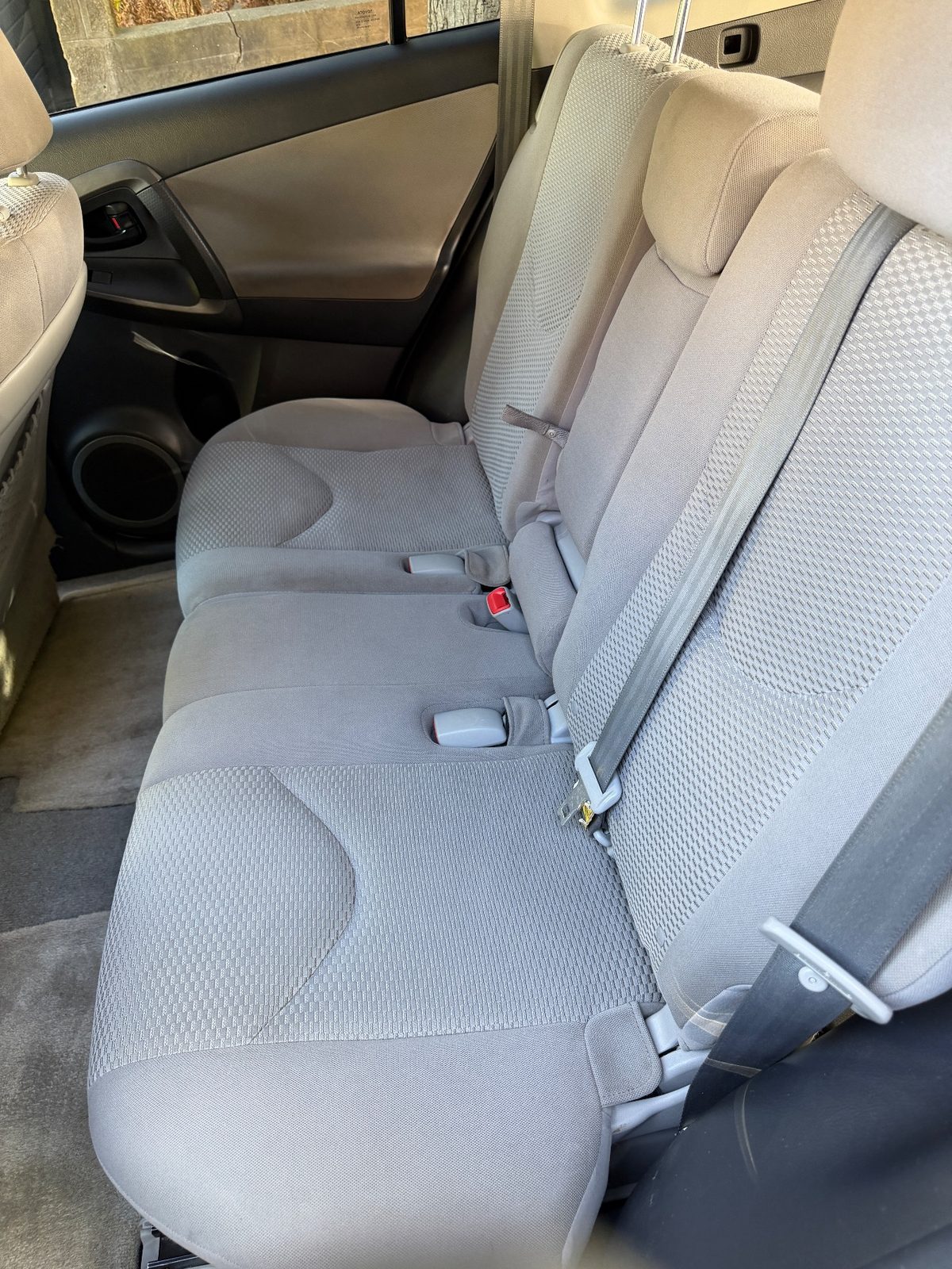 Clean rear bench seat of a 2011 Toyota RAV4 after detailing