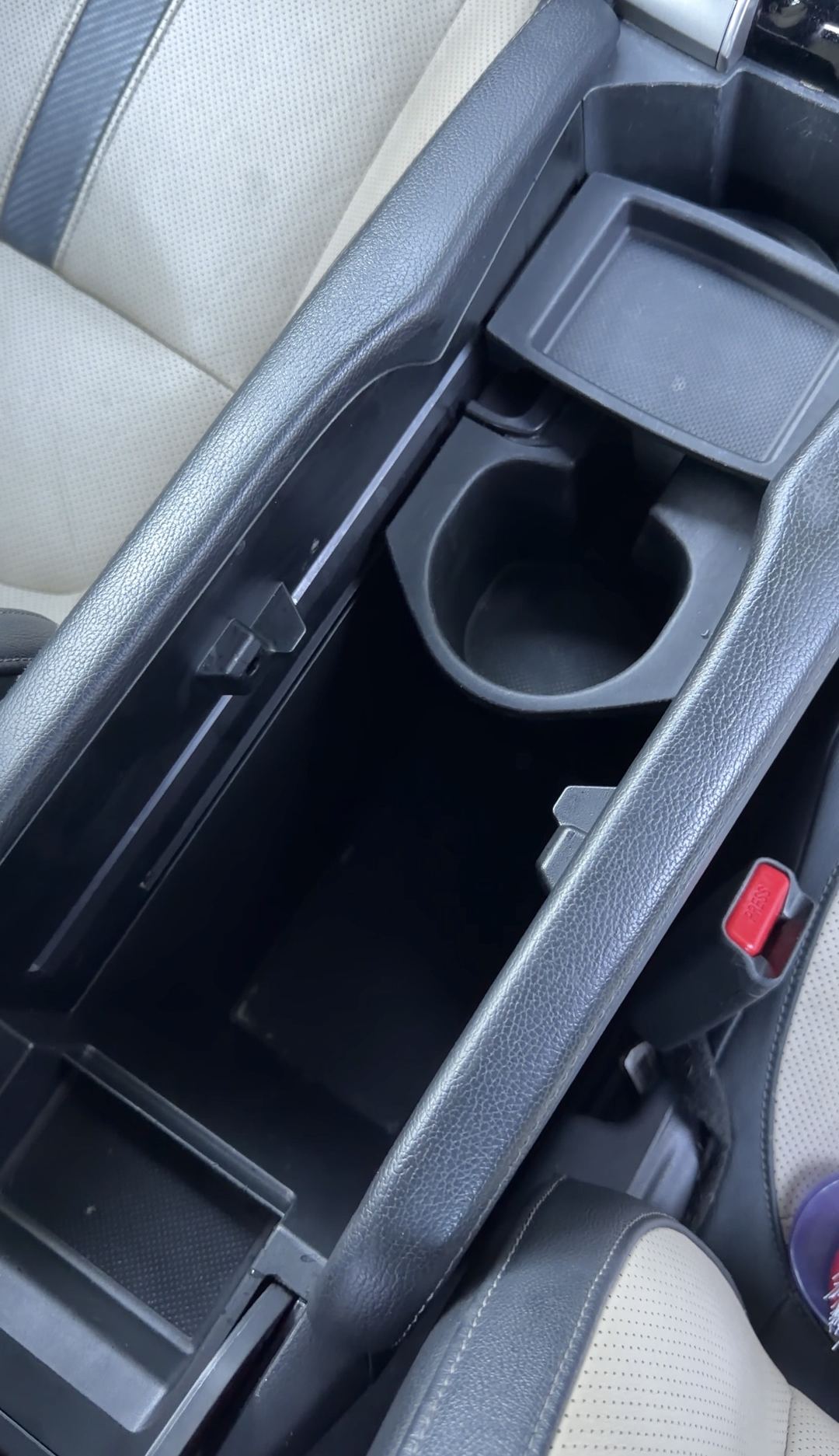 Cleaned centre console bin of a Honda Civic with the cupholder insert removed