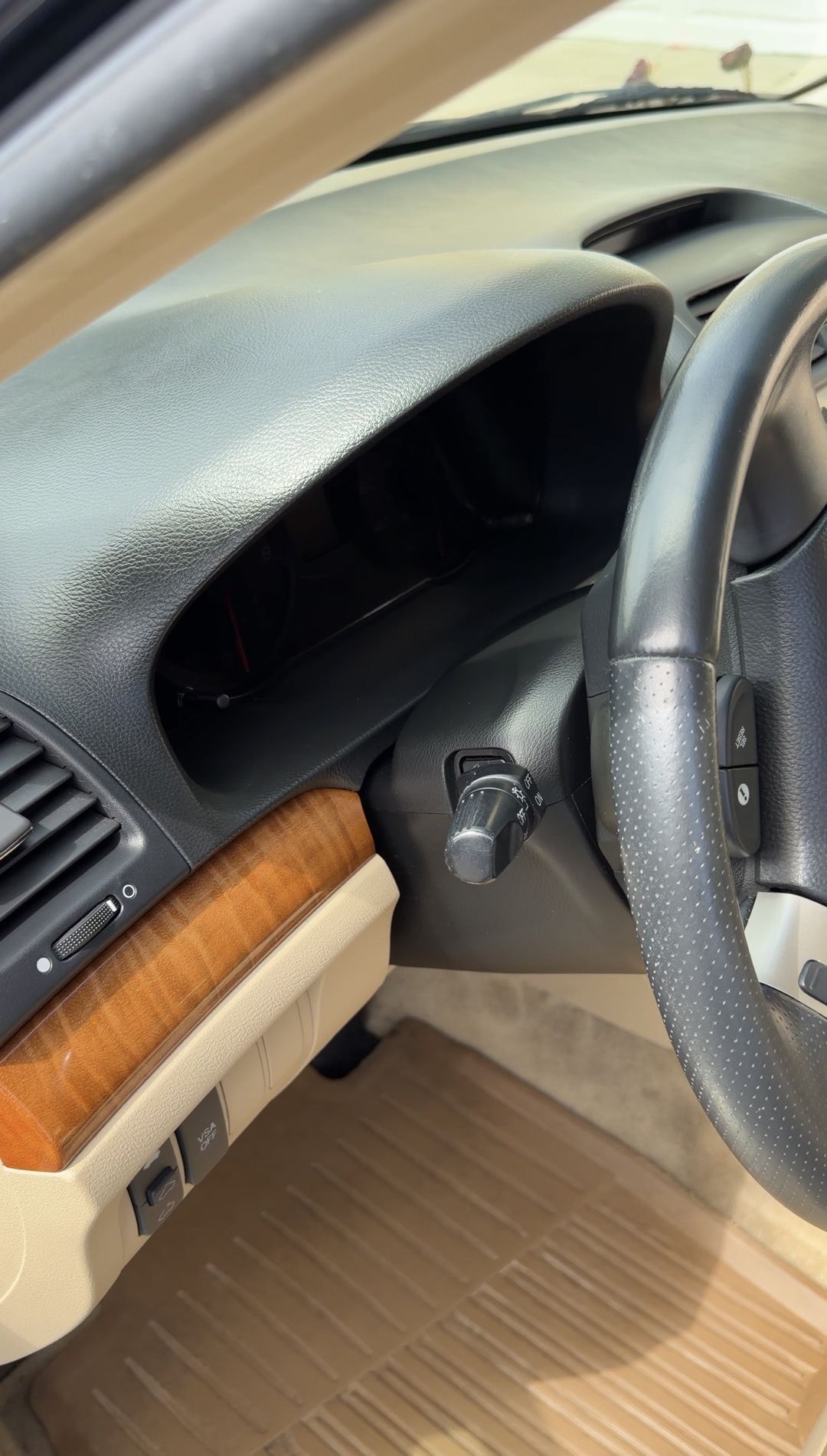 Cleaned dashboard, wood trim and steering wheel of an Acura TSX after detailing.