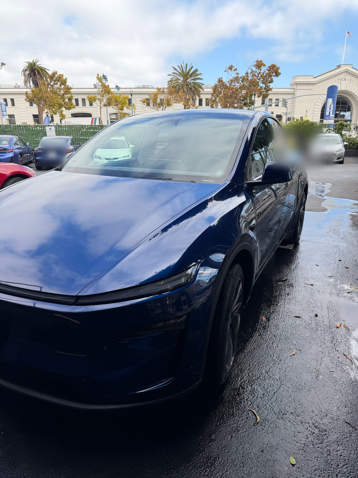 Blue Tesla Model Y front three-quarter after exterior detail, Downtown San Francisco
