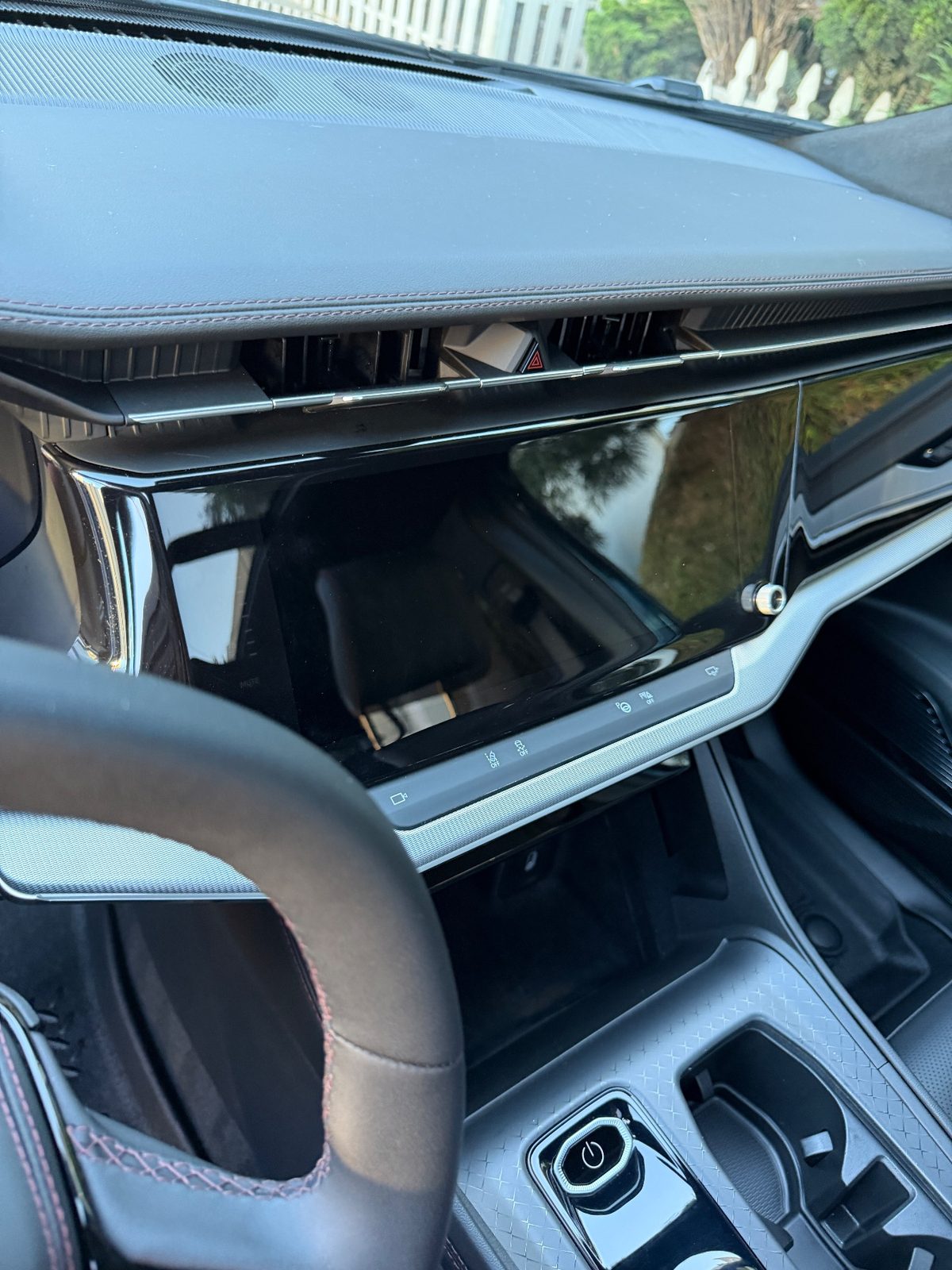 Clean dashboard and display of a Jeep Wagoneer S interior after detailing