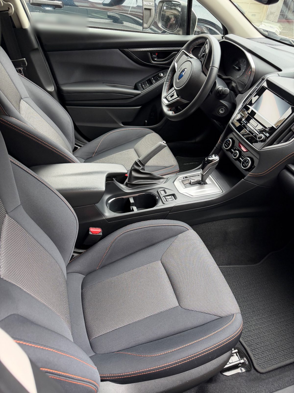 Clean front seats and console of a Subaru Crosstrek after cleaning