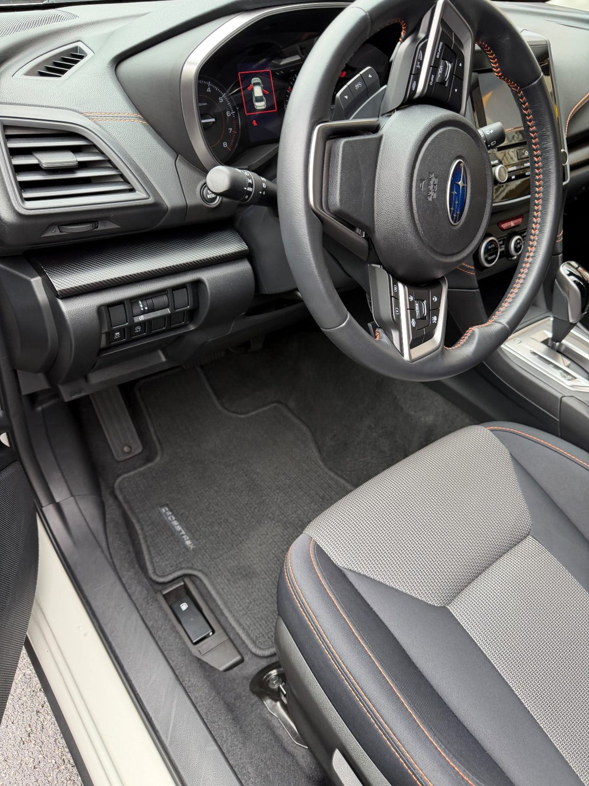 Driver footwell of a white Subaru Crosstrek in the Inner Richmond, San Francisco, after detailing
