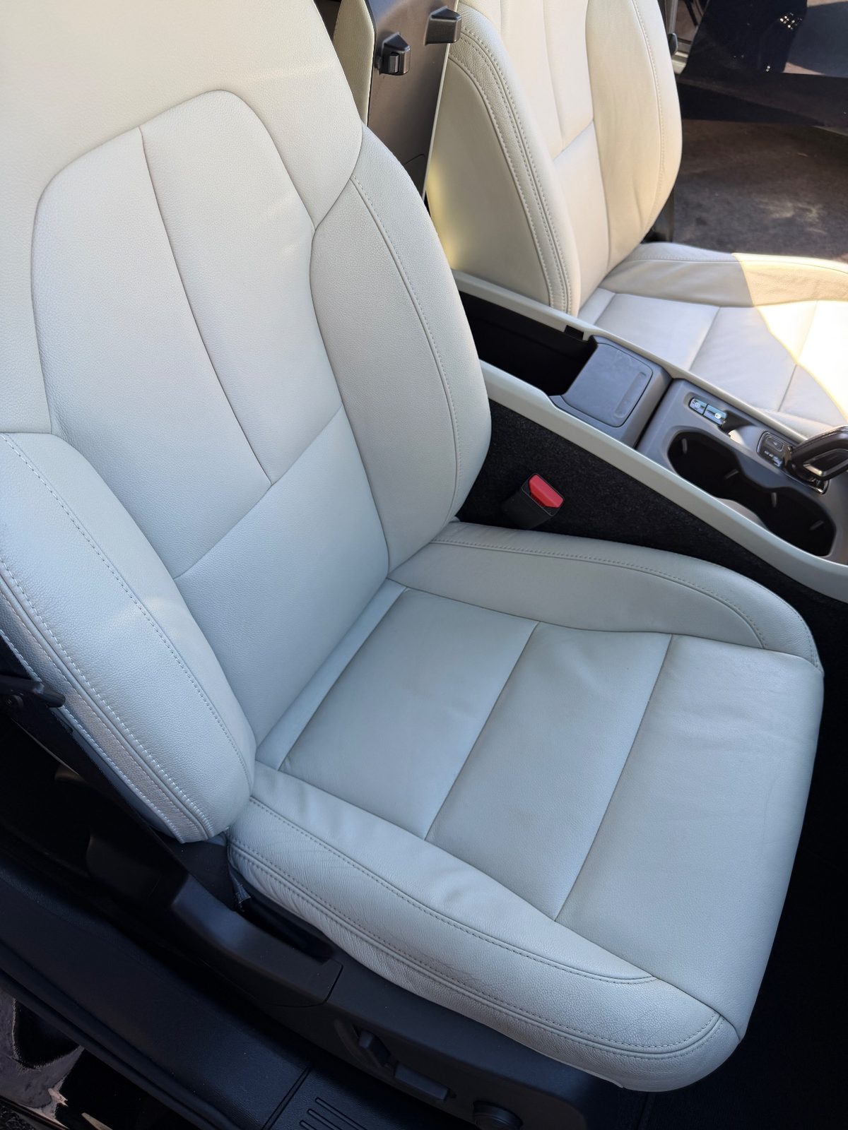 Front passenger leather seat of a Volvo XC40 after detailing, clean and even