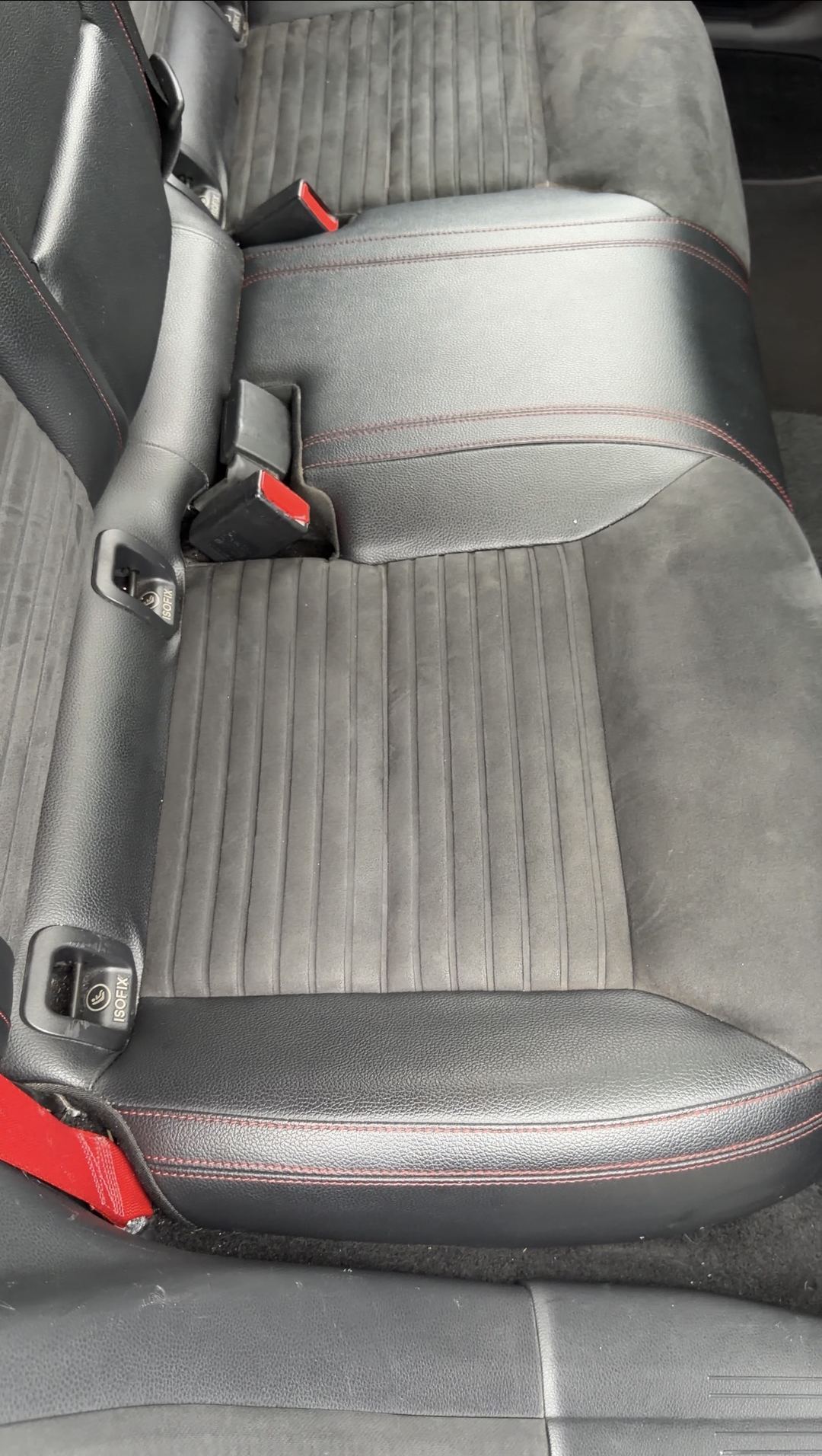 Rear bench seat of a Mercedes-Benz CLA250 before interior detailing