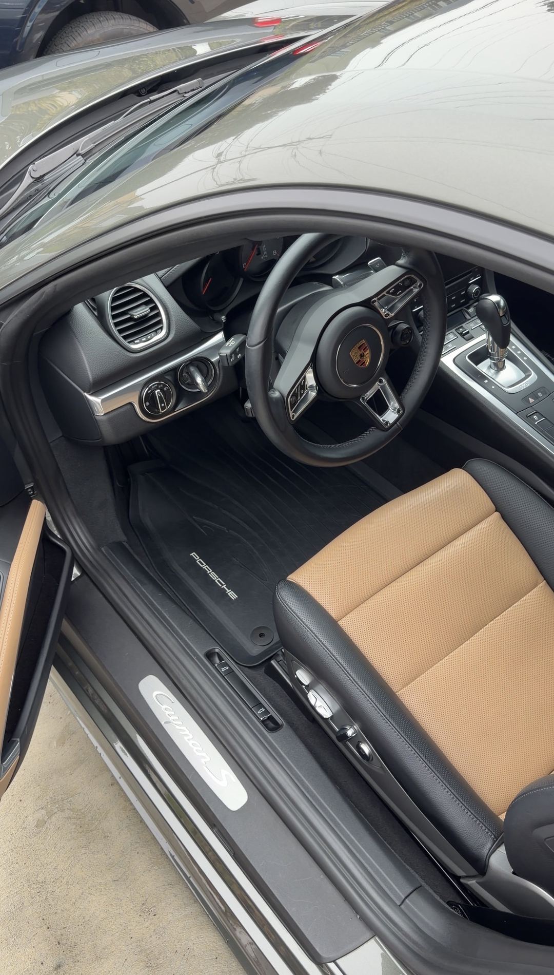 Clean driver's footwell and Cayman S door sill of a Porsche 718 after an interior detail.