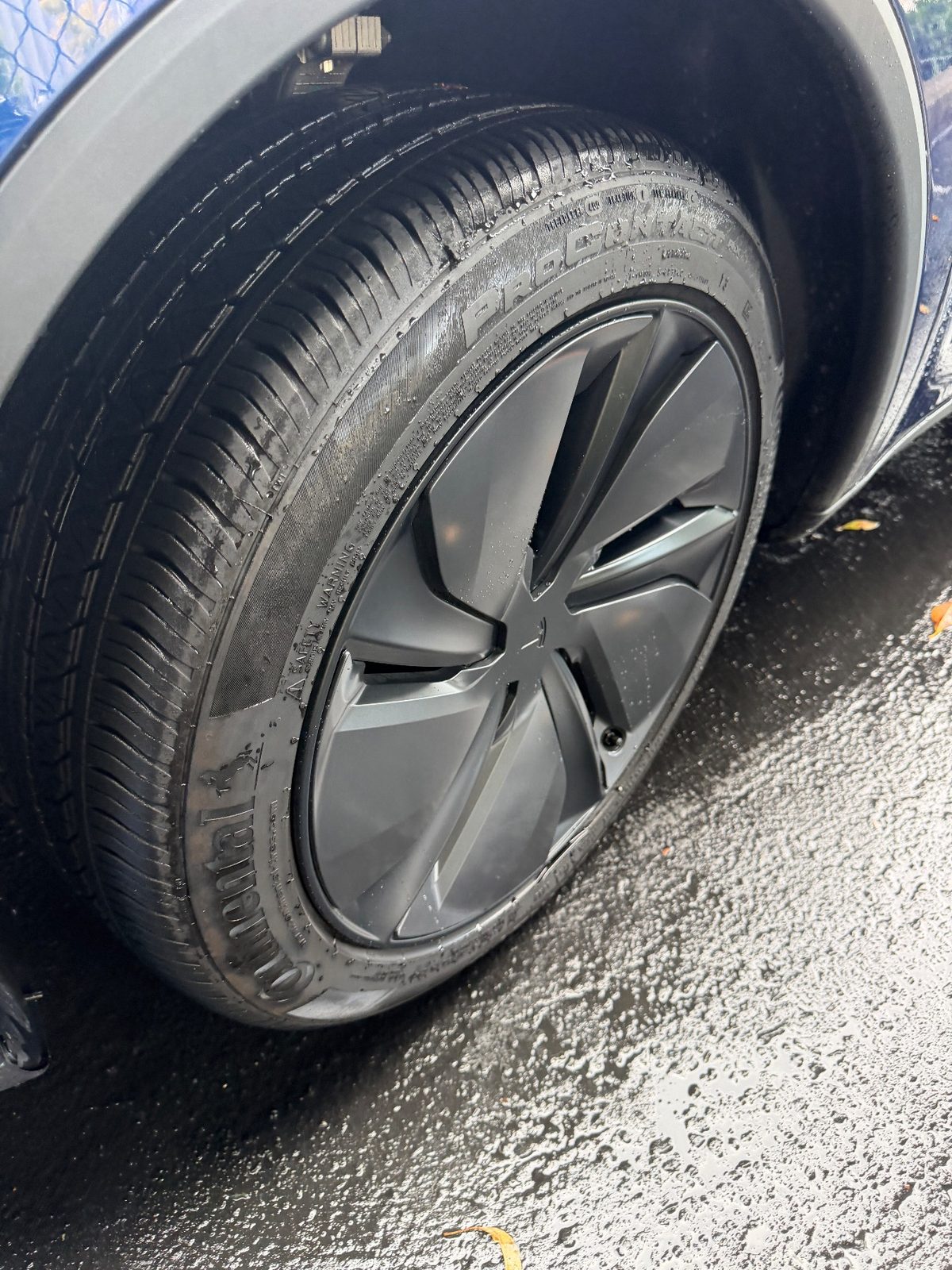 Blue Tesla Model Y wheel and tyre after exterior detail, Downtown San Francisco