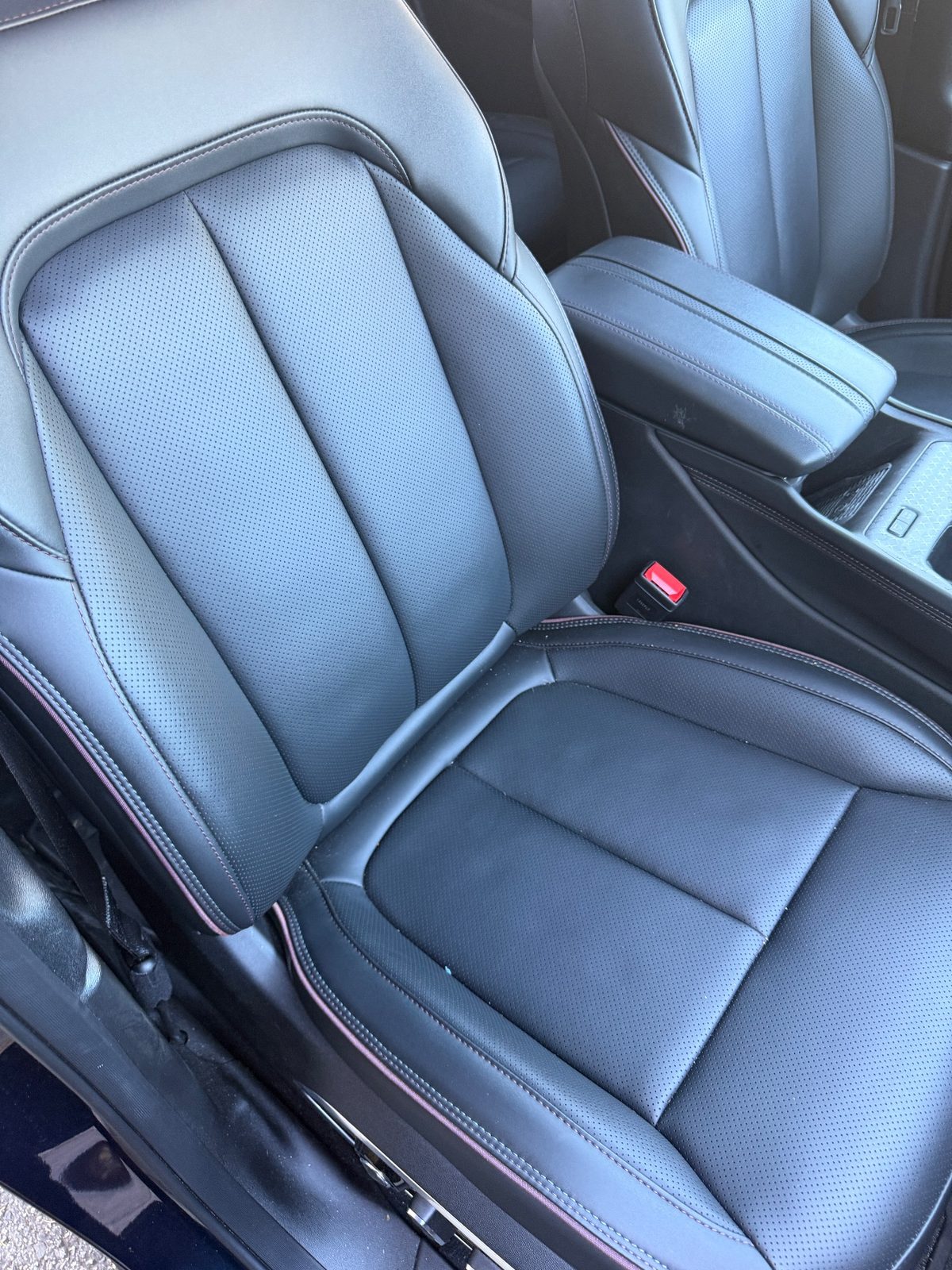Driver leather seat of a Jeep Wagoneer S before detailing