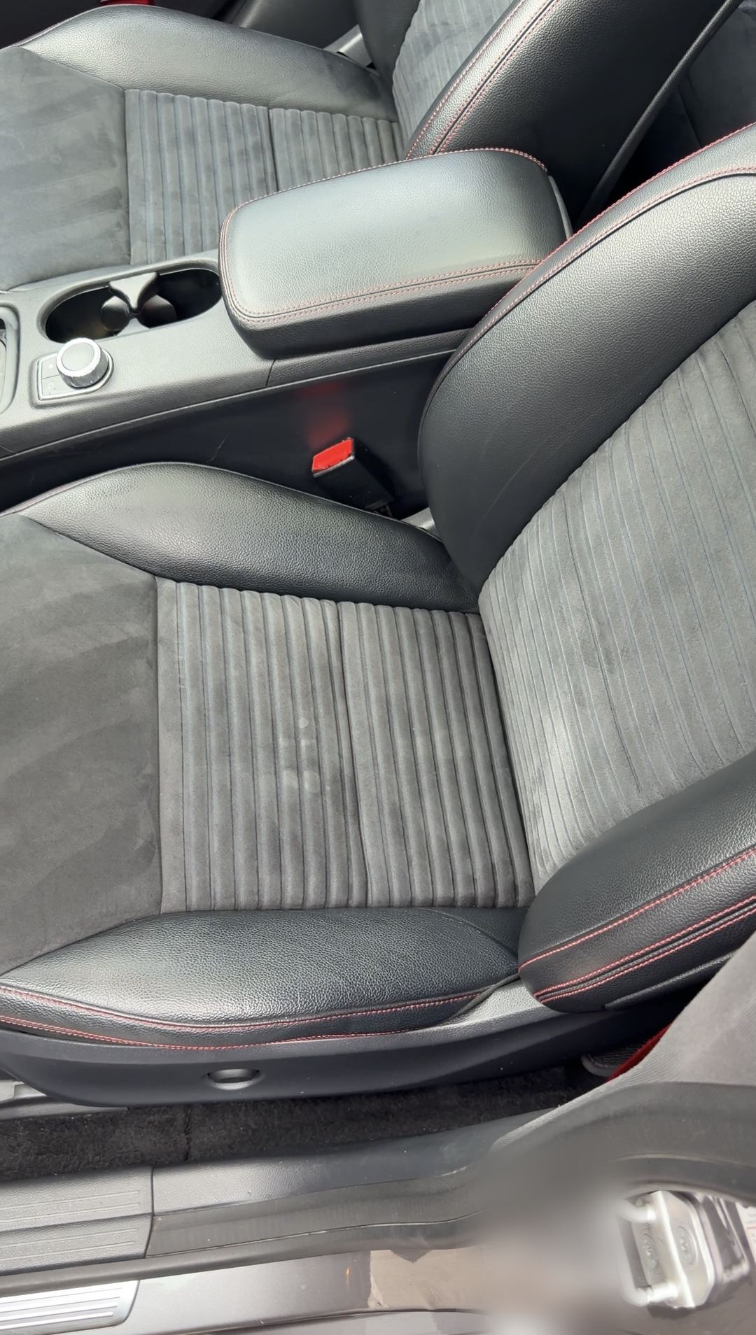 Cleaned front seats of a Mercedes-Benz CLA250 with grey microfibre centres and red contrast stitching