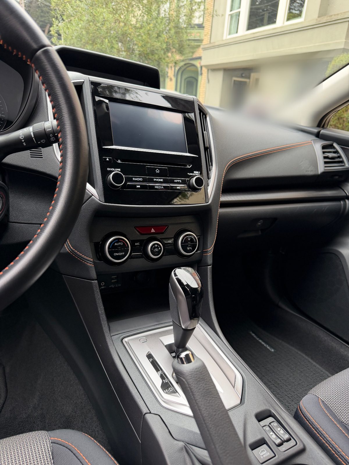 Clean dash and infotainment screen in a Subaru Crosstrek after cleaning