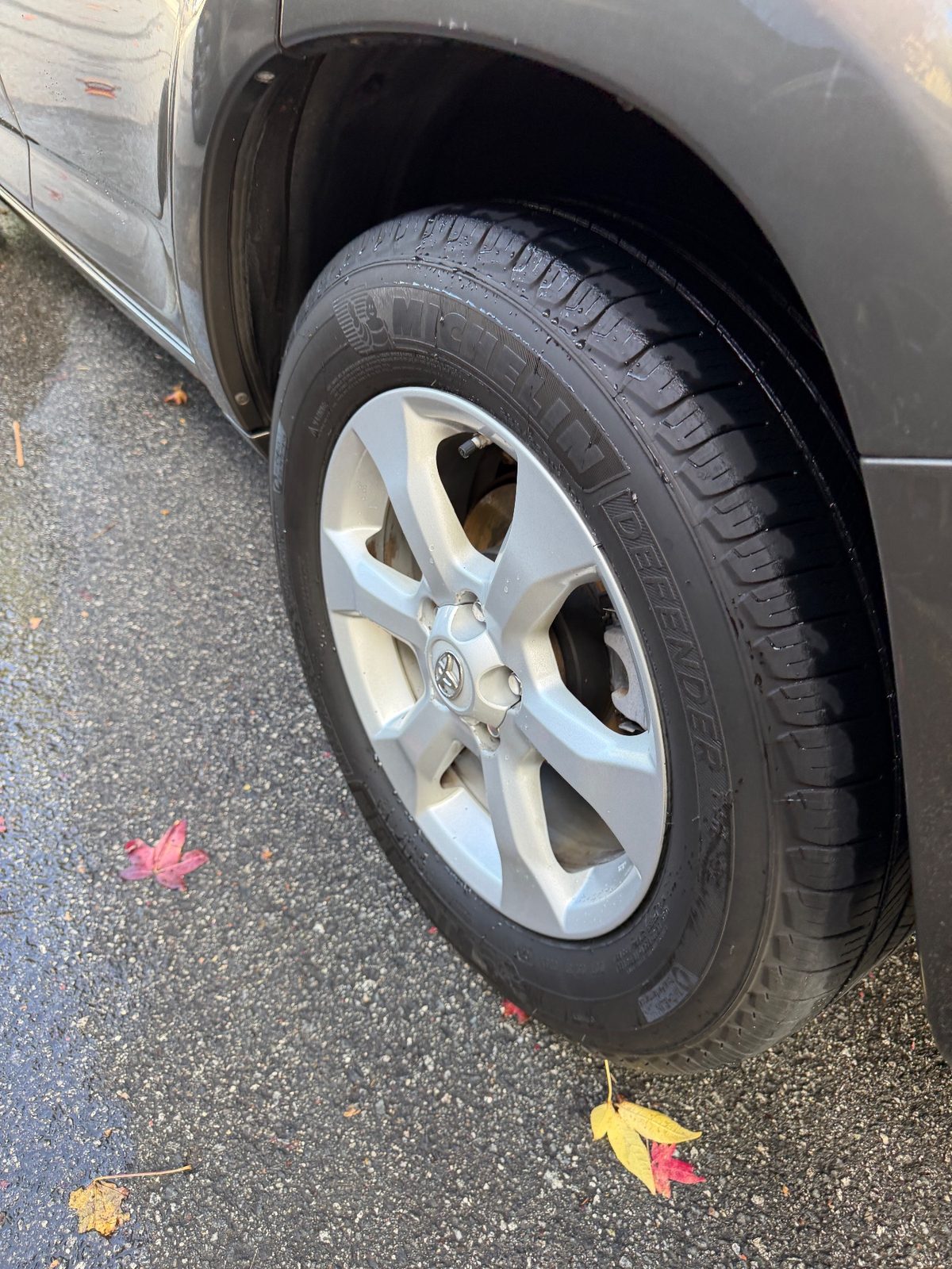 Clean alloy wheel and dressed tyre on a 2011 Toyota RAV4 after cleaning