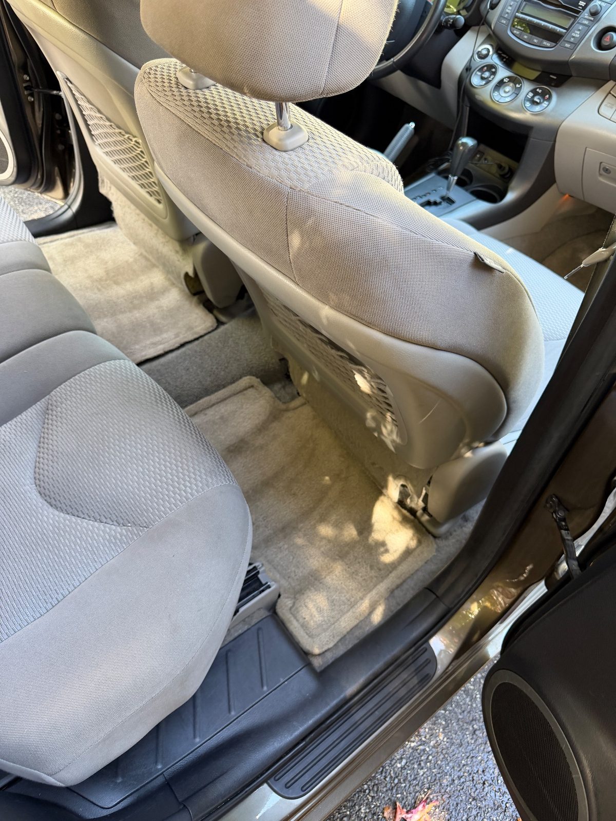 Vacuumed rear footwell of a 2011 Toyota RAV4 after detailing