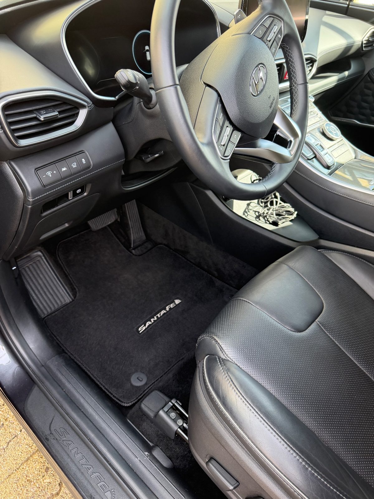 Vacuumed driver footwell mat of a Hyundai Santa Fe after detailing