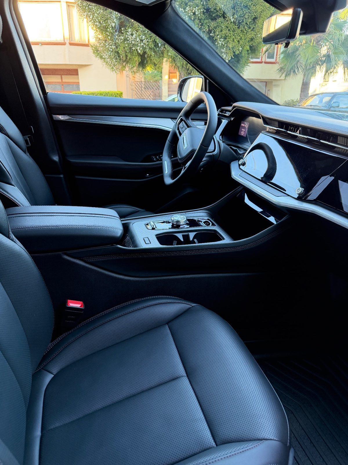 Clean leather front seat and cabin of a Jeep Wagoneer S after detailing