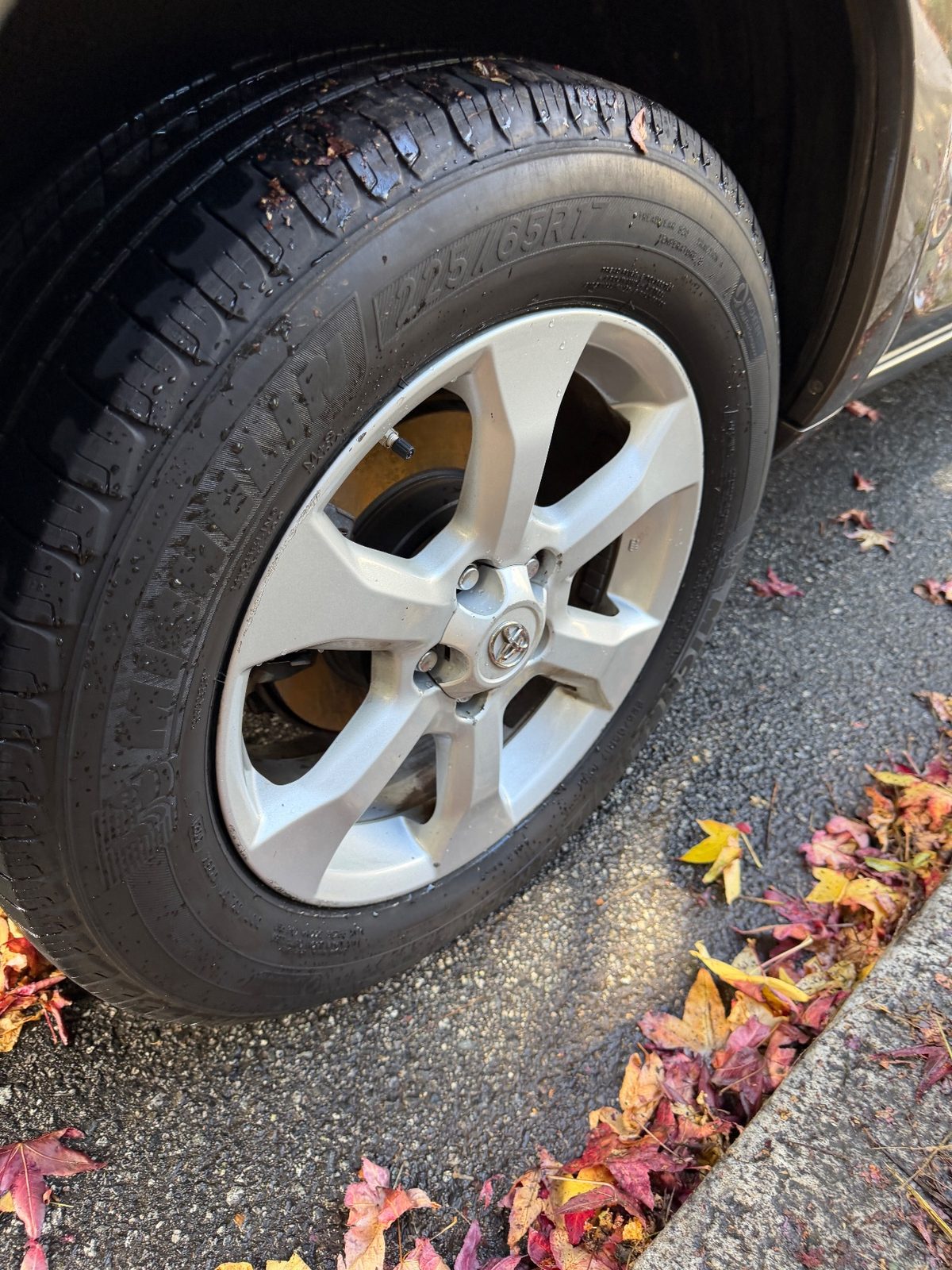 Clean alloy wheel and dressed tyre on a 2011 Toyota RAV4 after cleaning