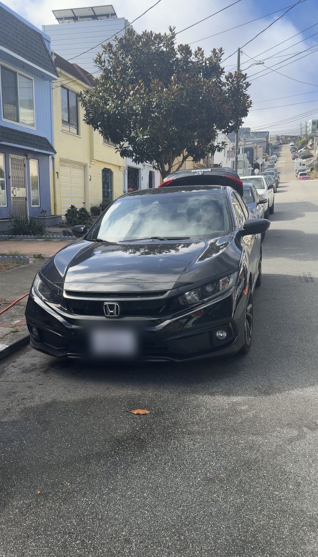 Black 2019 Honda Civic Sport parked on a Glen Park street before its exterior detail