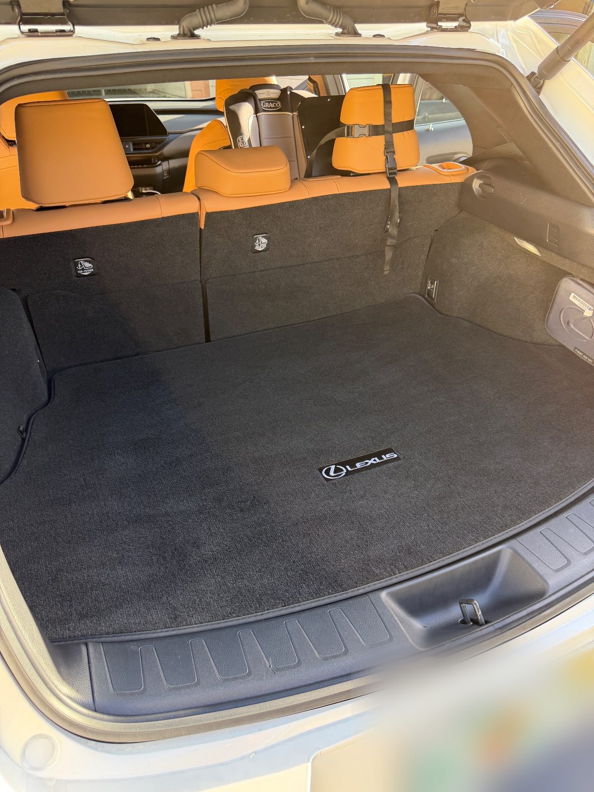 Clean cargo area of a white Lexus UX after detailing