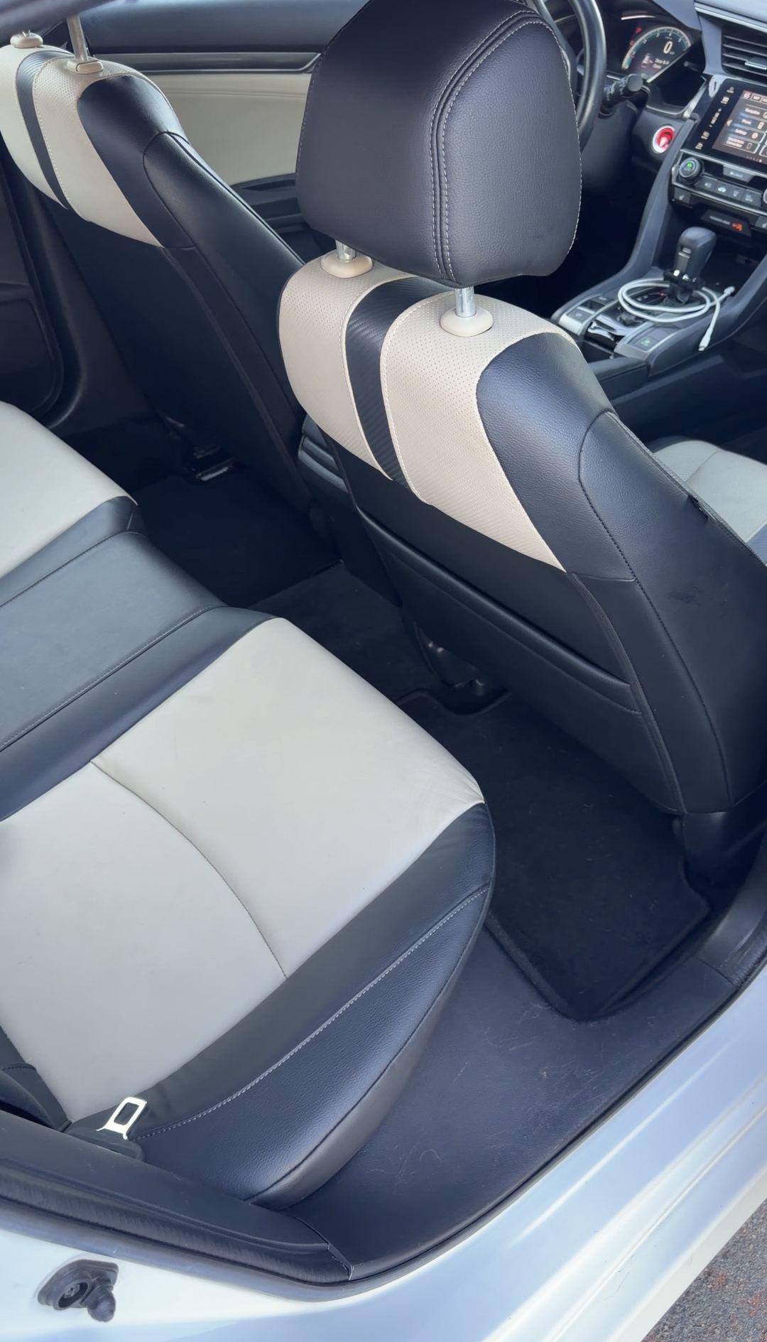 Cleaned rear seats and floor of a Honda Civic after interior detailing