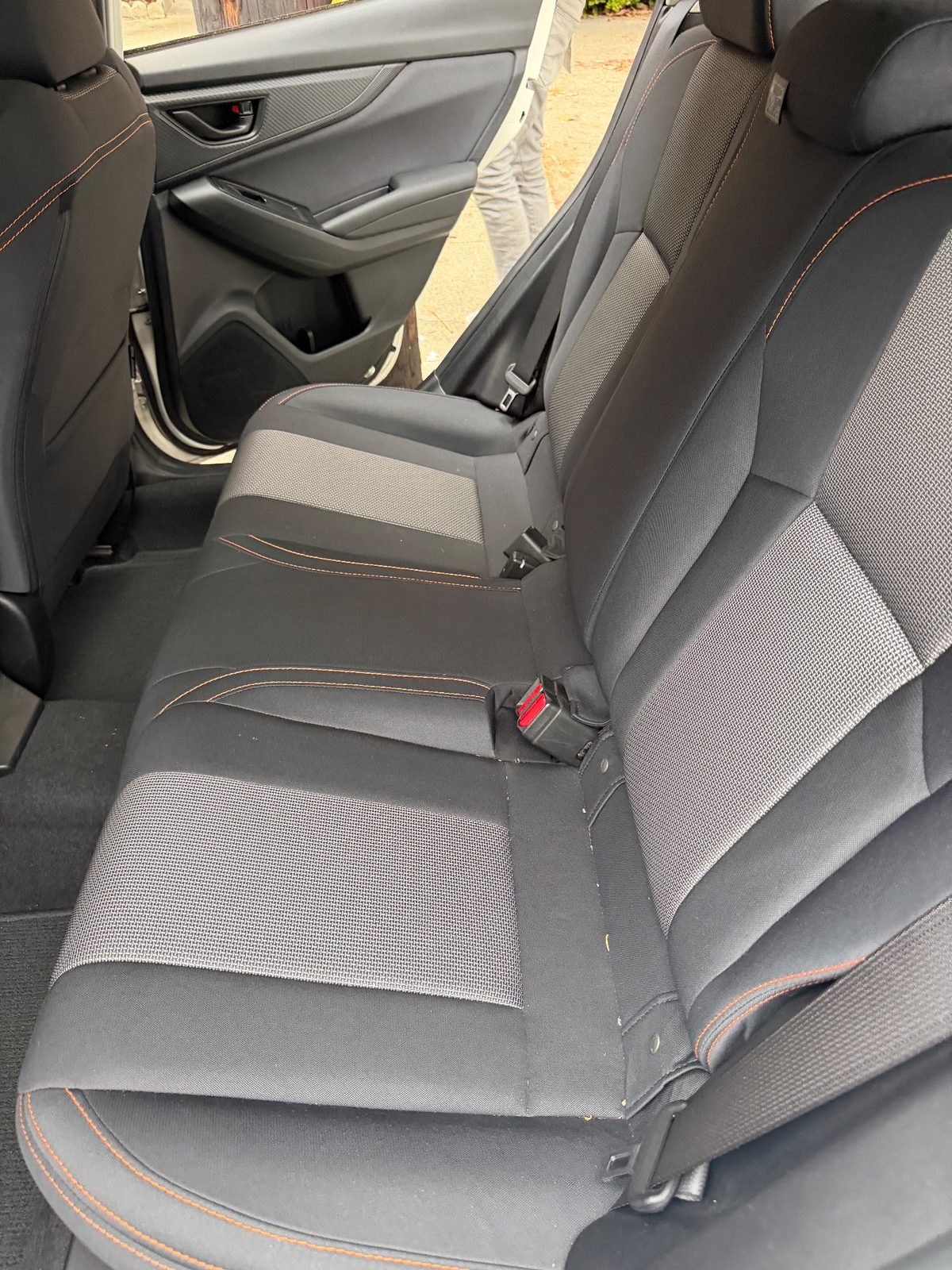 Rear bench of a white Subaru Crosstrek in the Inner Richmond, San Francisco, before detailing