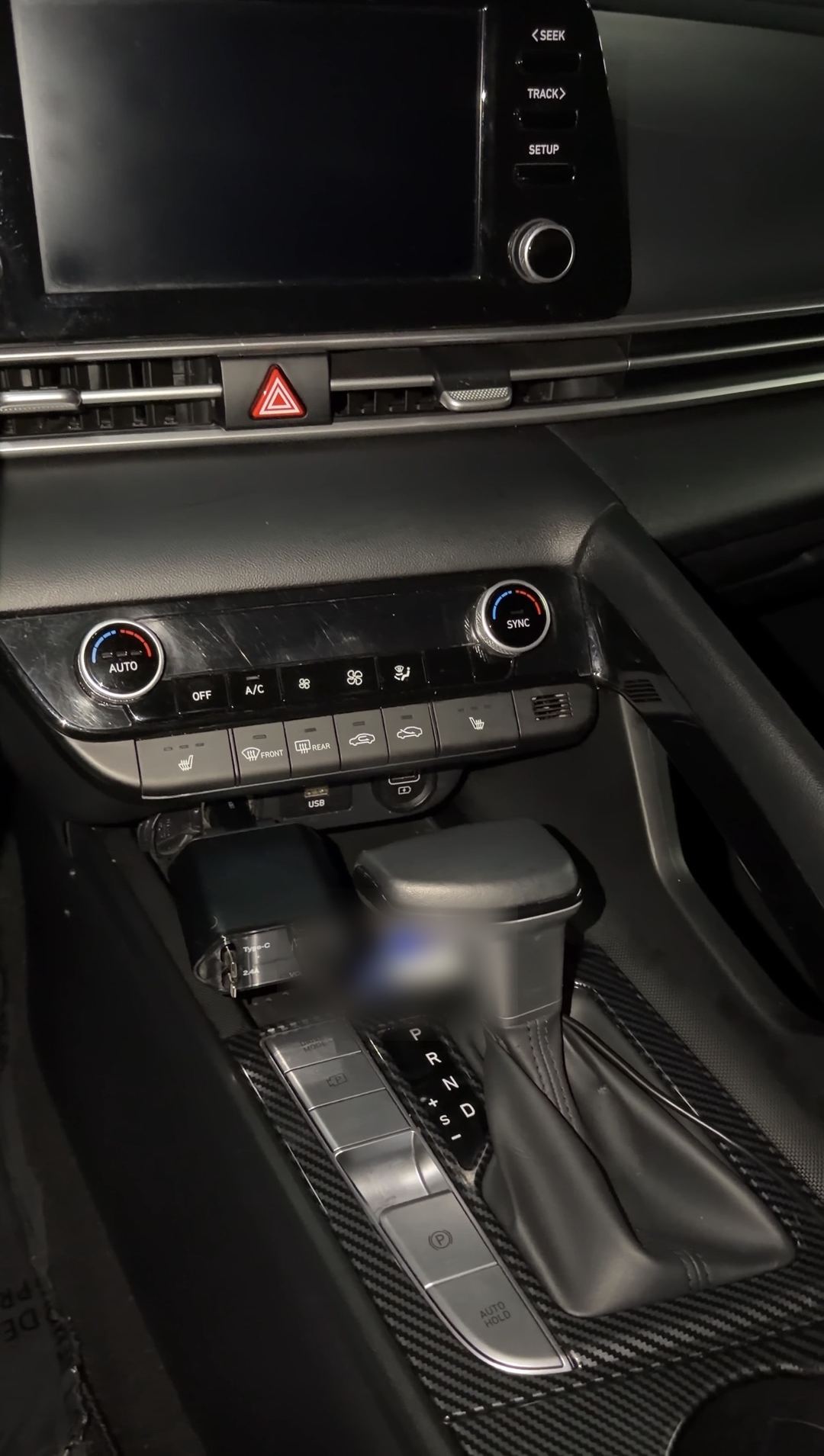Clean centre stack, climate controls and shifter in a Hyundai Elantra after detailing
