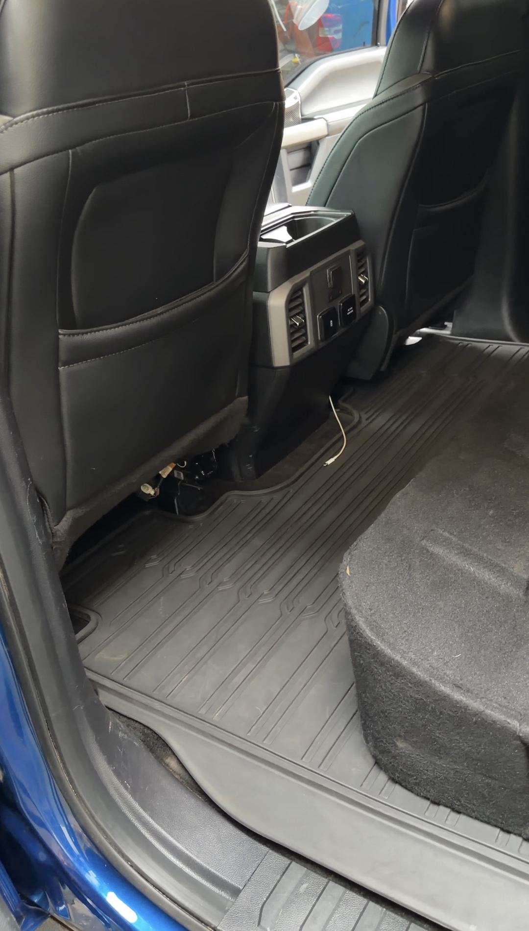 Clean rear footwell of a Ford F-150 Raptor after an interior detail
