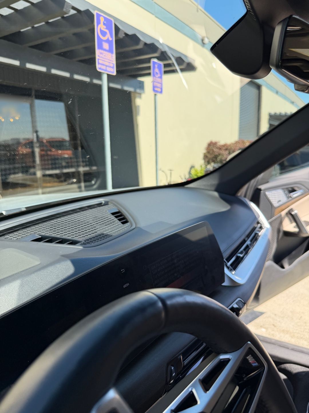 Windshield of a grey BMW X1 from inside before detailing