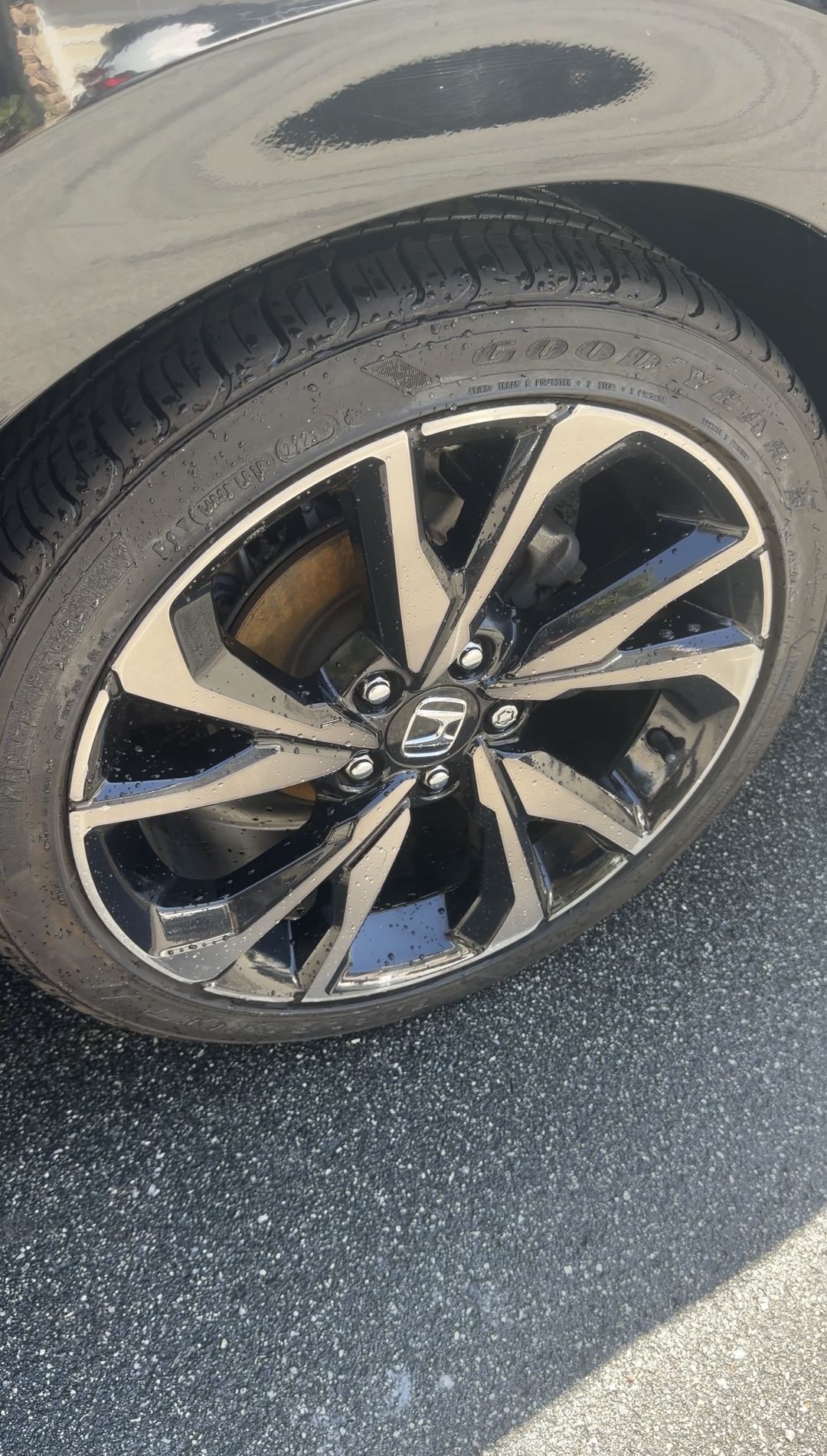 Clean alloy wheel and dressed tyre on a Honda Civic Sport after the detail