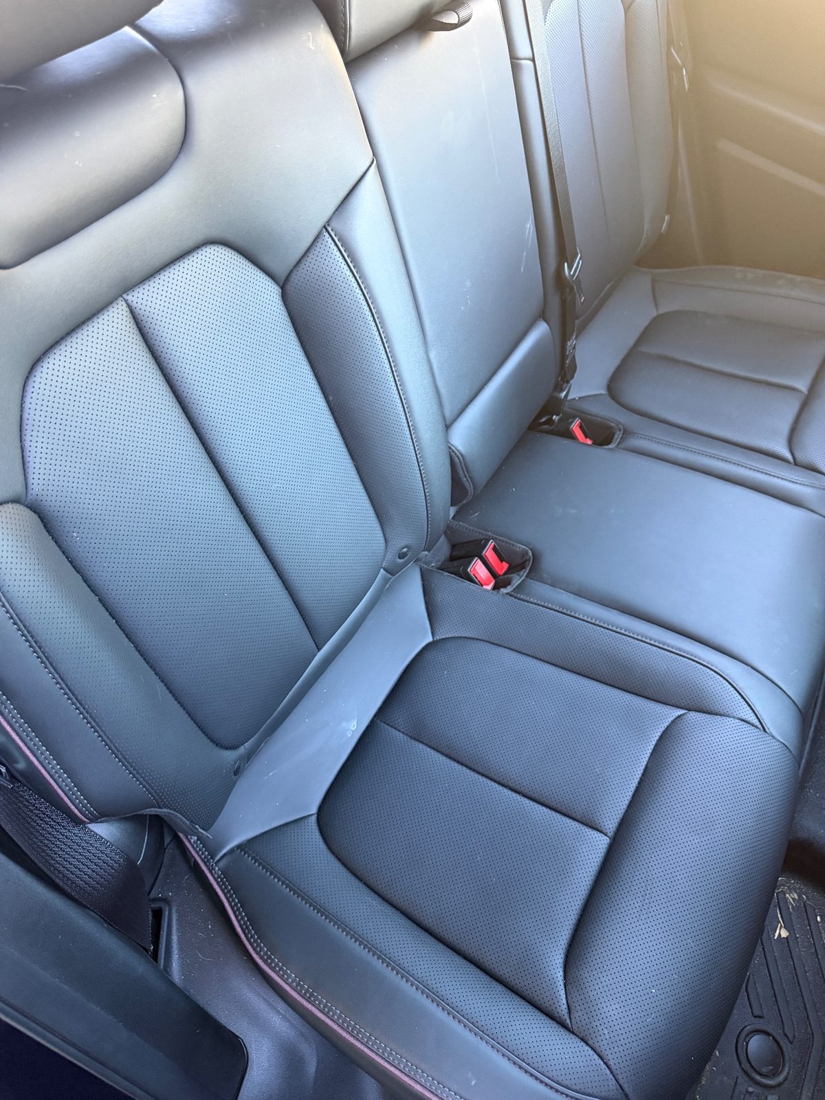 Rear leather bench of a Jeep Wagoneer S before detailing