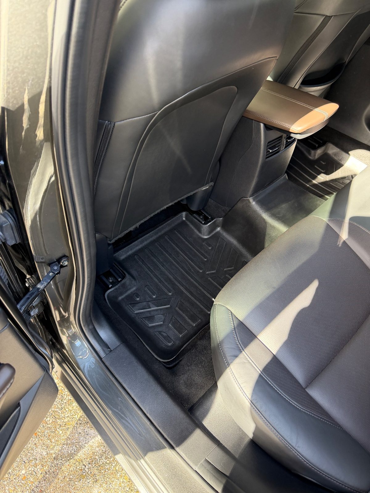 Rear footwell, left side of a dark grey Mazda CX-30 in North Beach, San Francisco, after detailing