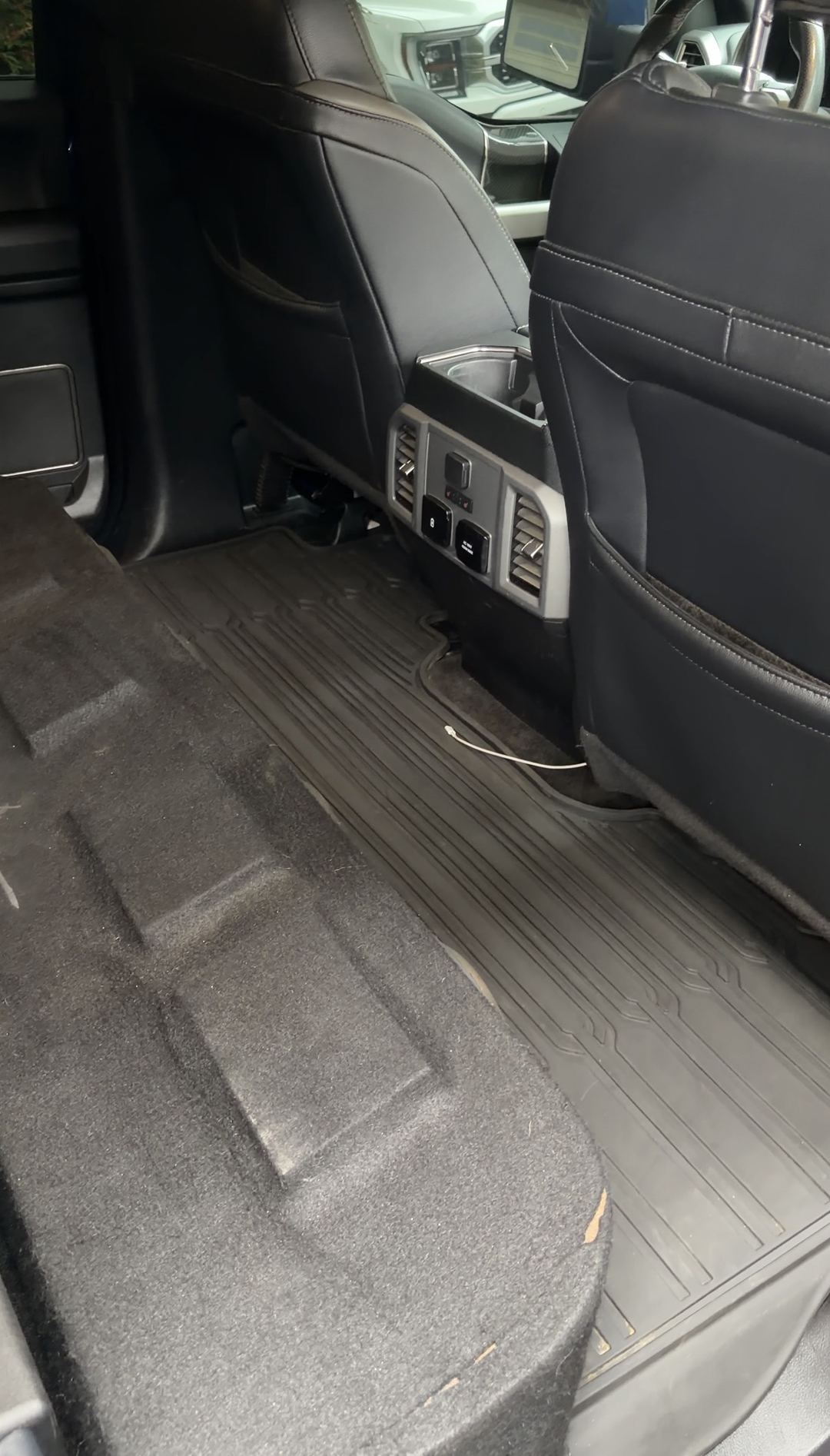 Clean rear floor of a Ford F-150 Raptor after an interior detail