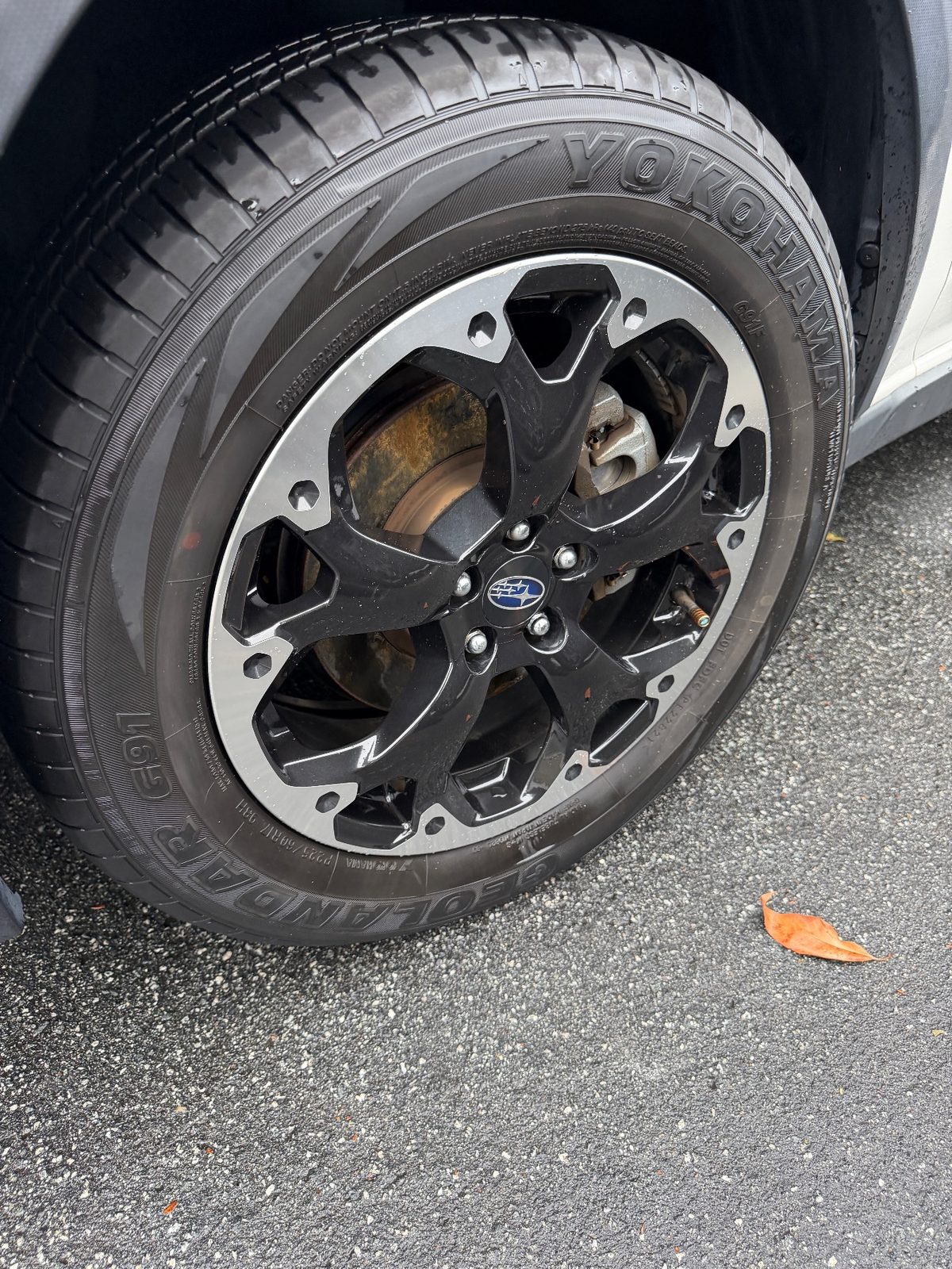 Front wheel of a white Subaru Crosstrek in the Inner Richmond, San Francisco, after detailing