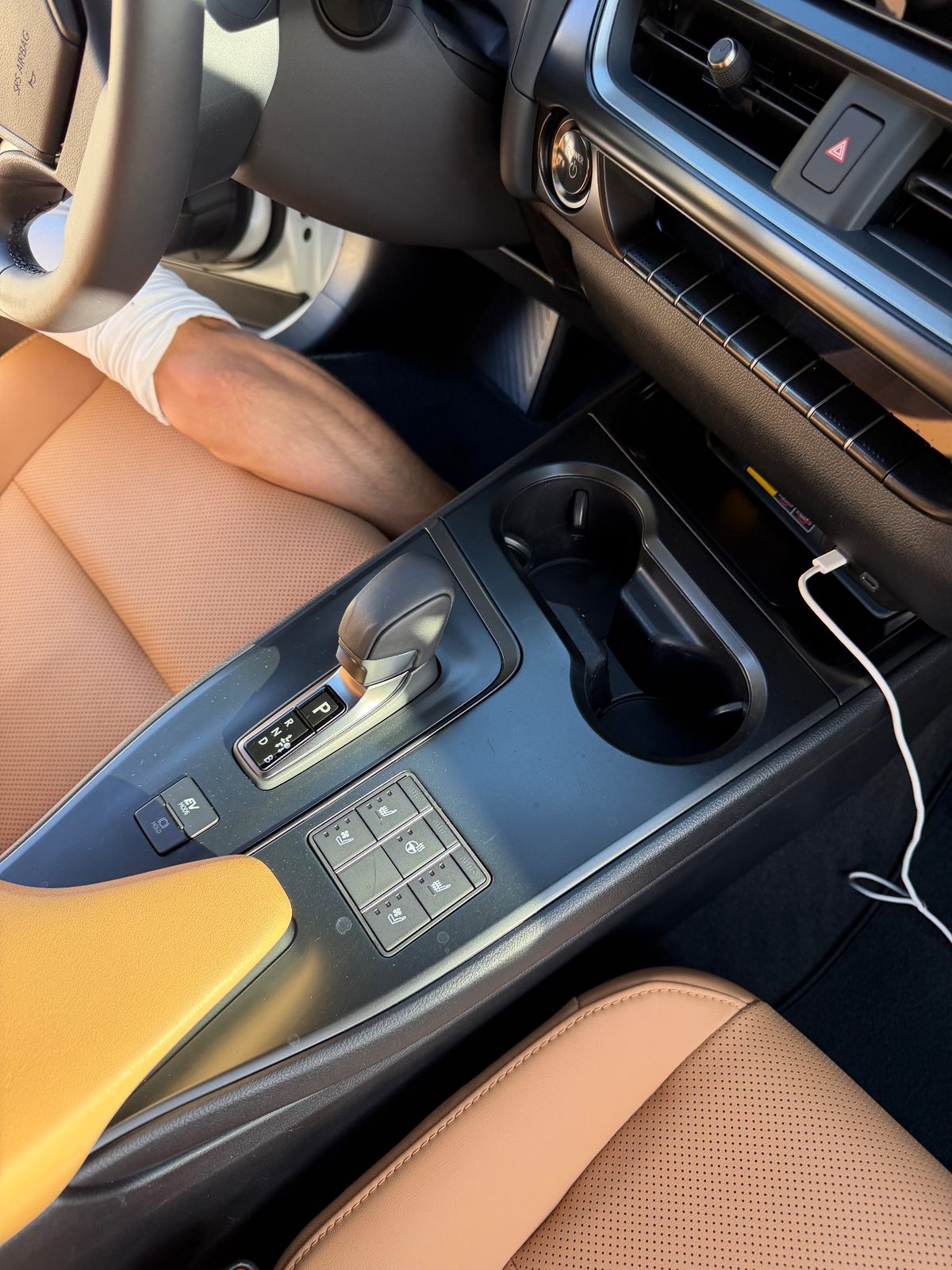 Clean centre console and shifter of a white Lexus UX after detailing