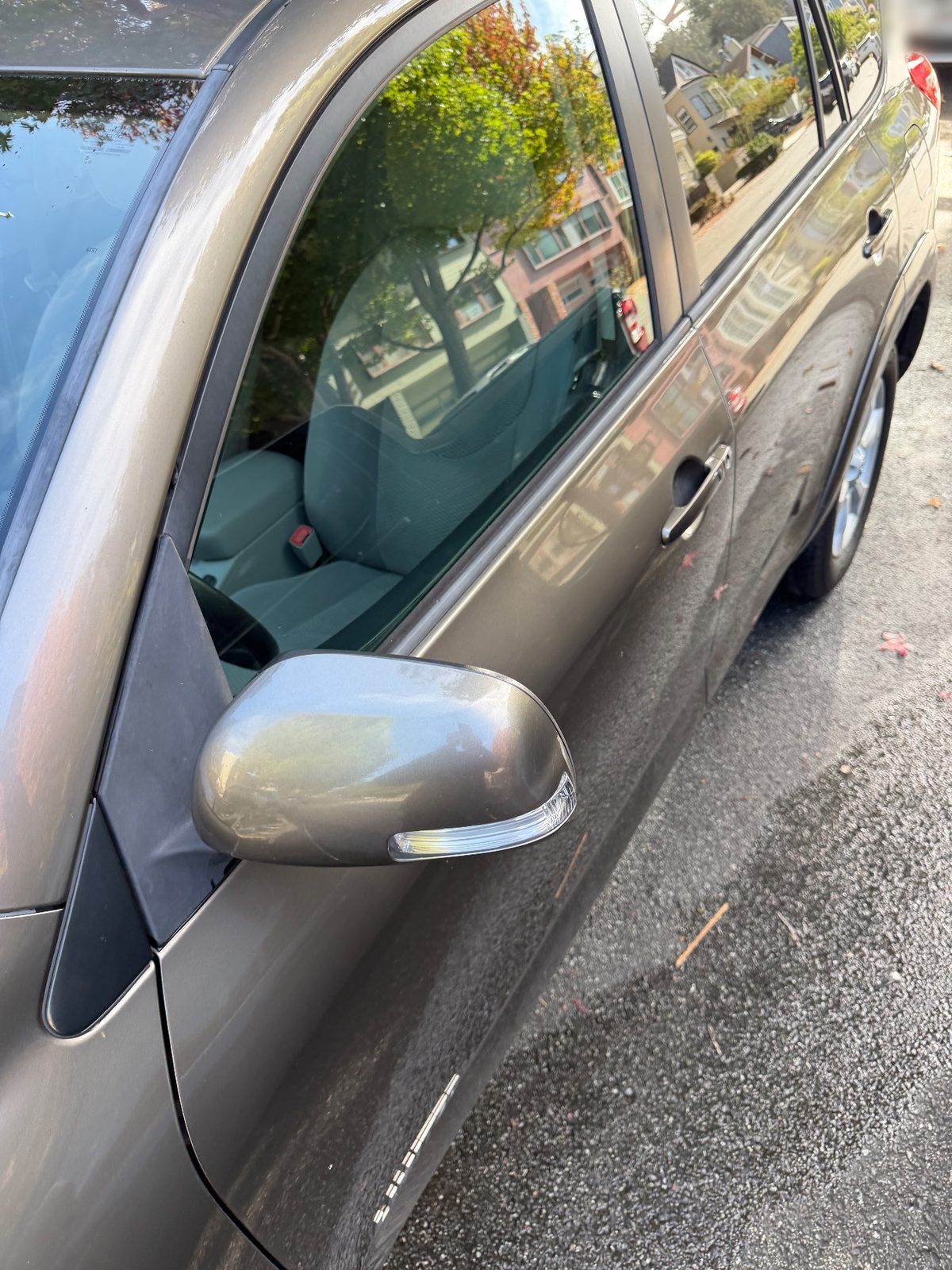Clean door and mirror of a 2011 Toyota RAV4 after washing