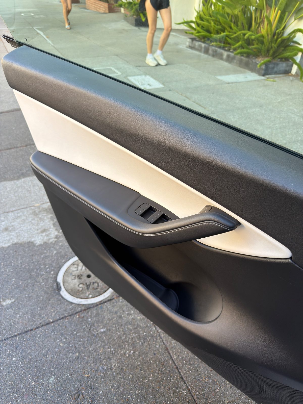 Clean front door card of a Tesla Model Y after detailing