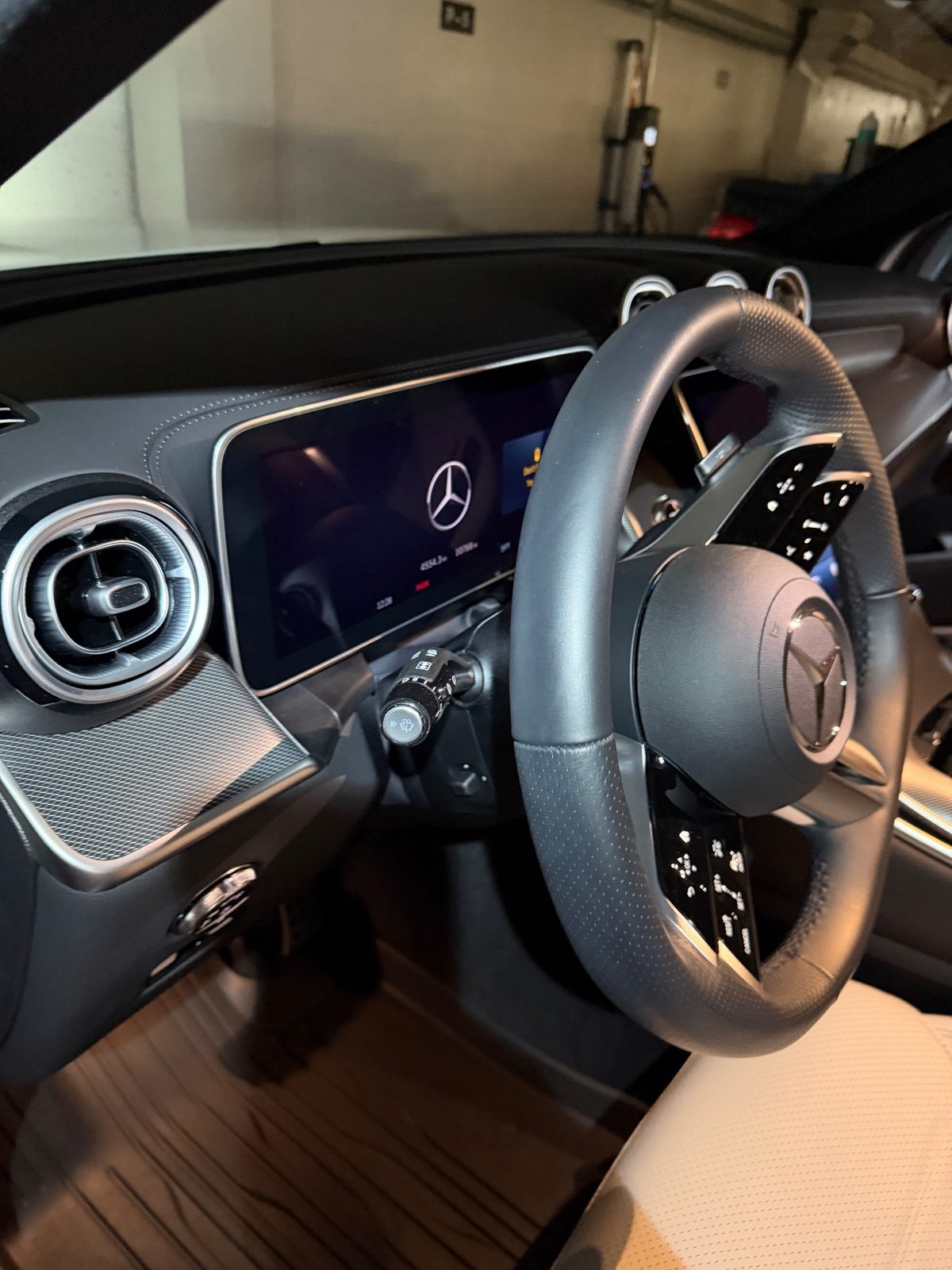 Steering wheel and digital cluster of a white Mercedes GLC after detailing