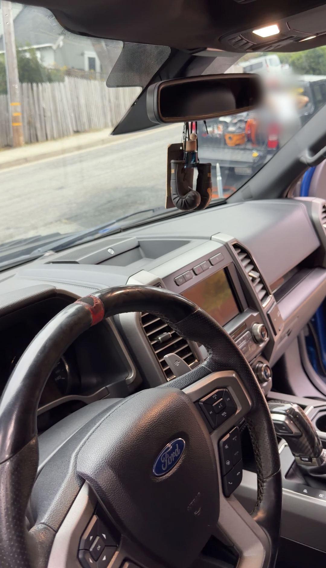 Clean dash top and windshield of a Ford F-150 Raptor after an interior detail