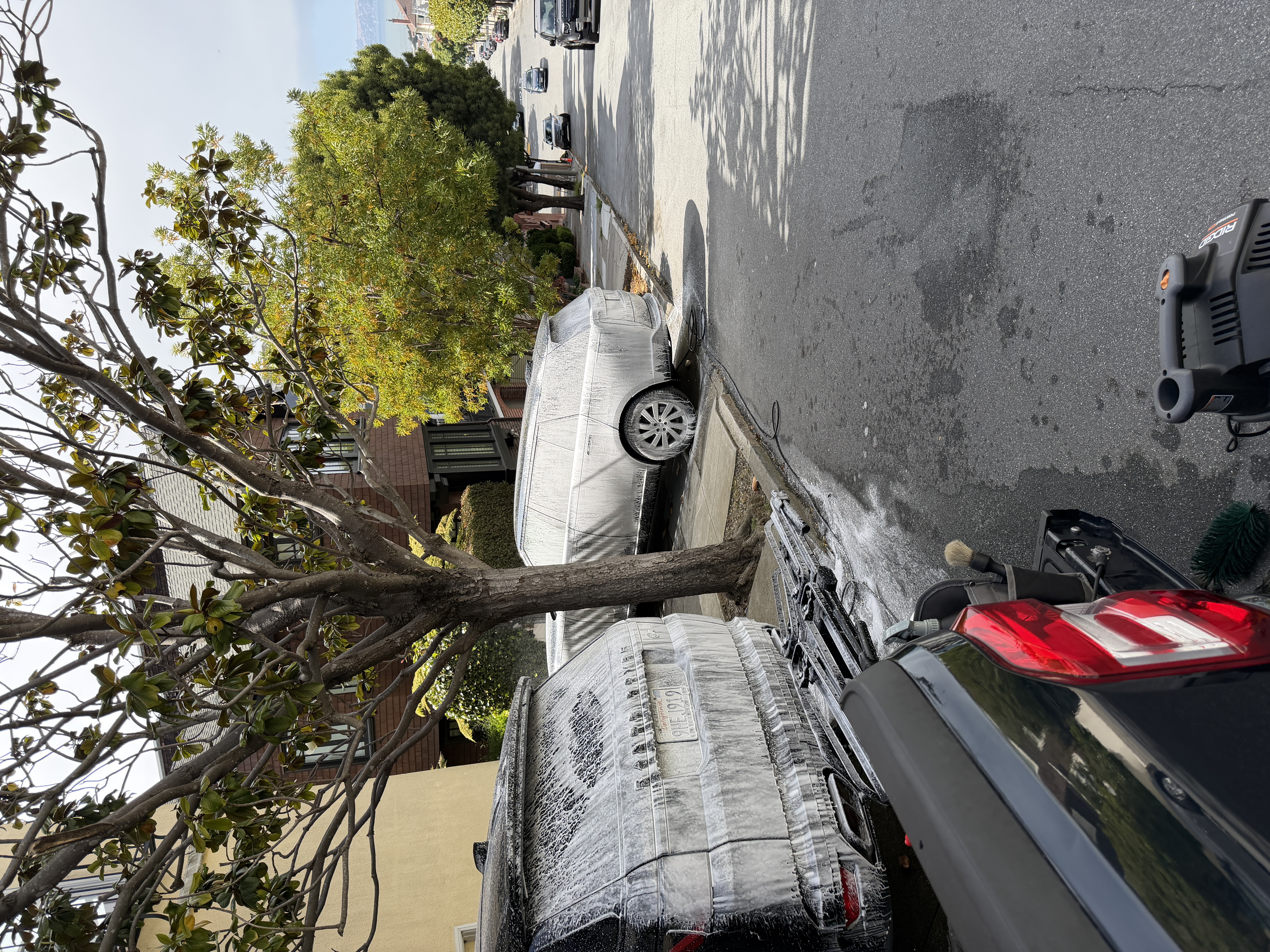 Range Rover SVR and Land Rover Discovery both foamed down during full detail in Pacific Heights, San Francisco