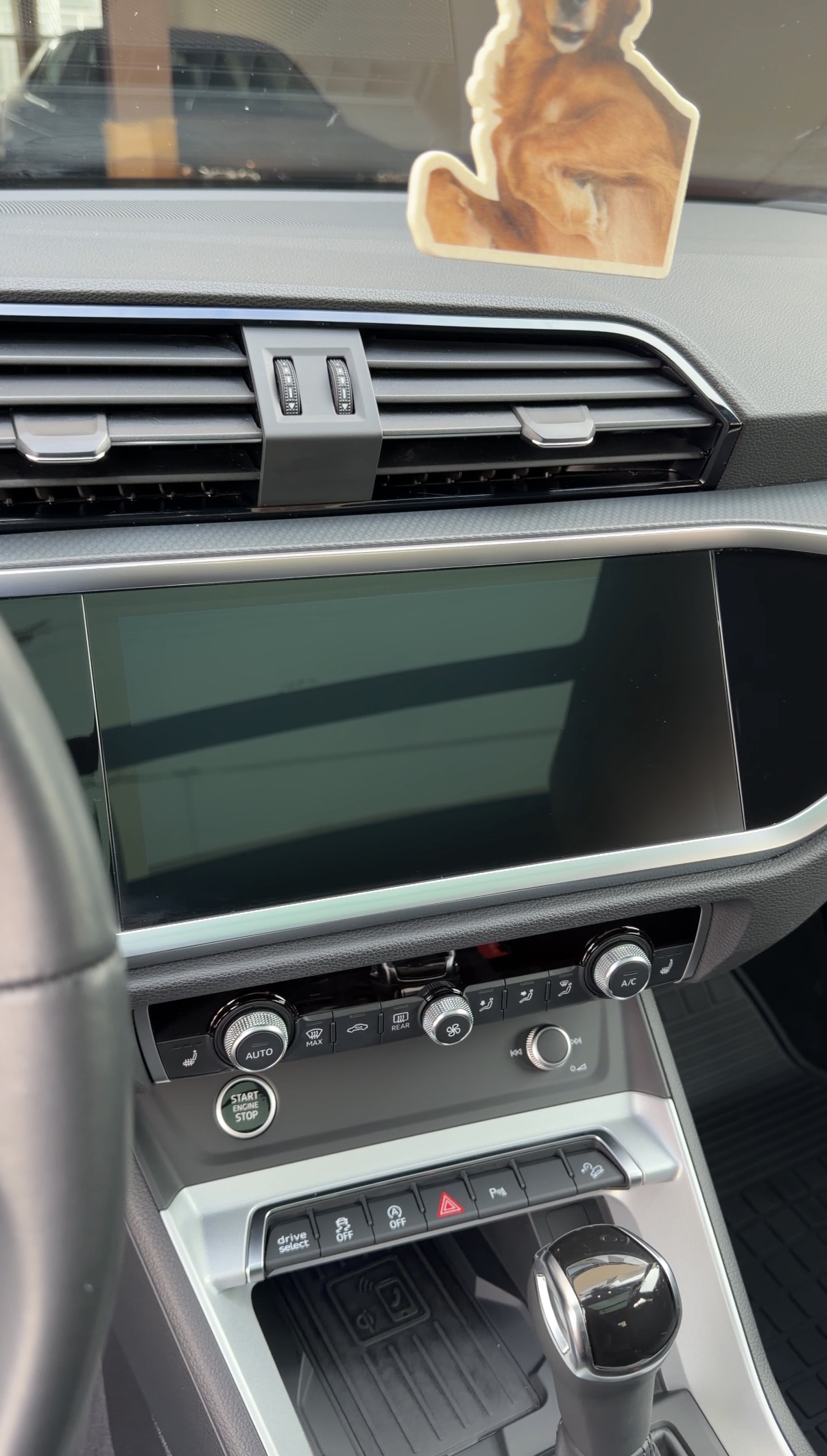Audi Q3 media controls and console after interior detail in the Marina District, San Francisco