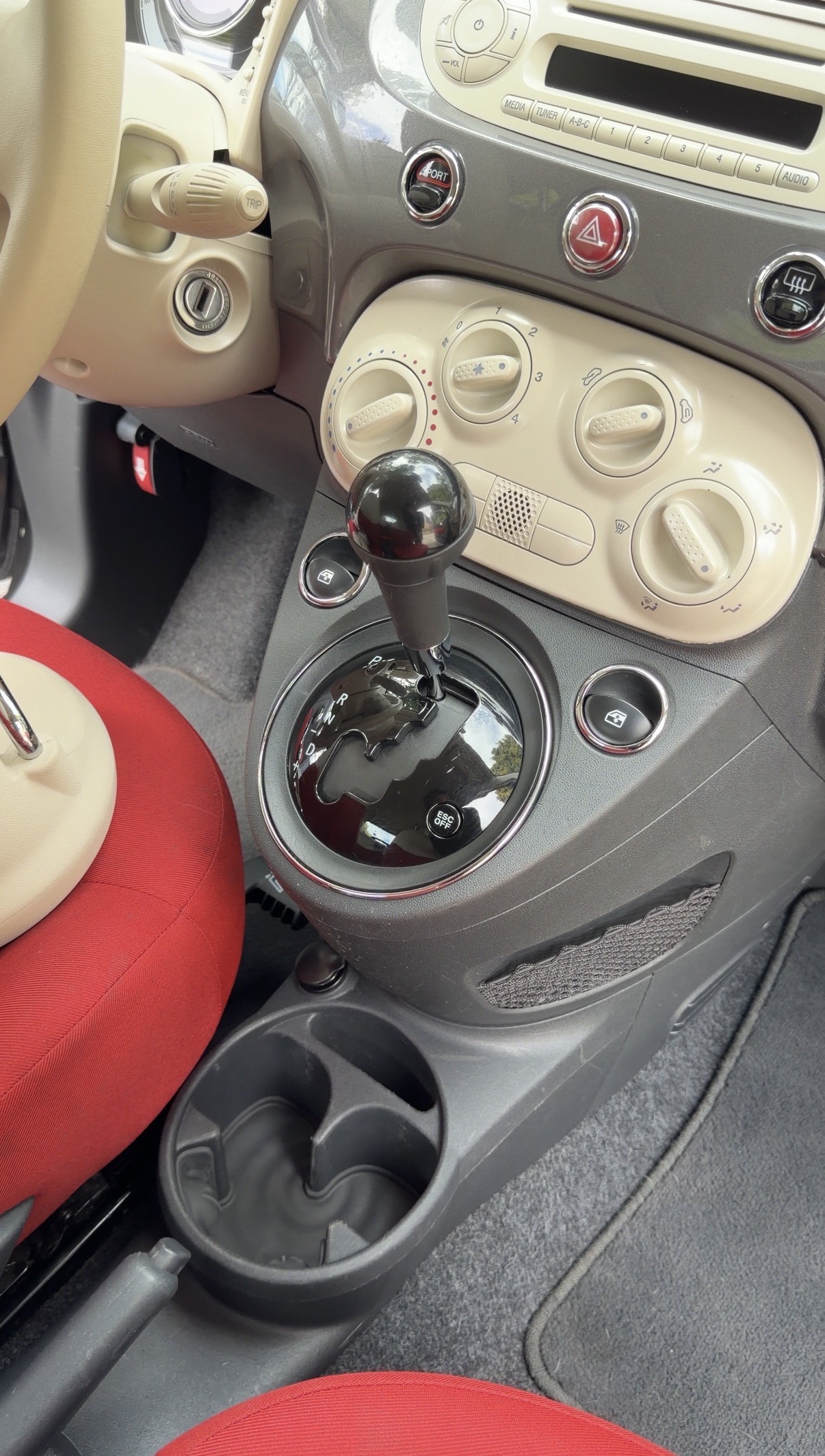 Fiat 500 center console after detailing, empty clean cup holder
