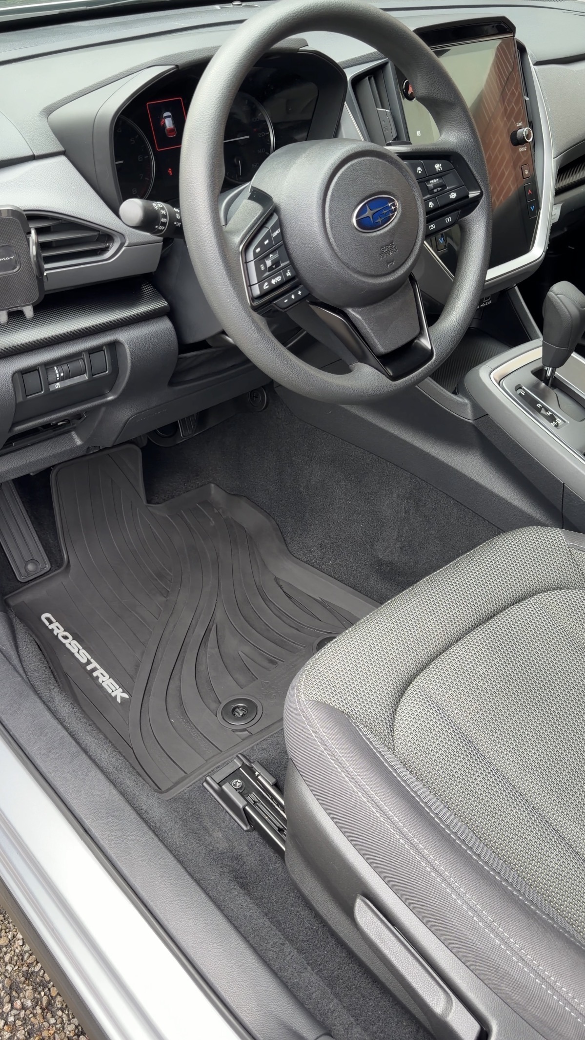 Subaru Crosstrek driver floor mat after detailing, clean
